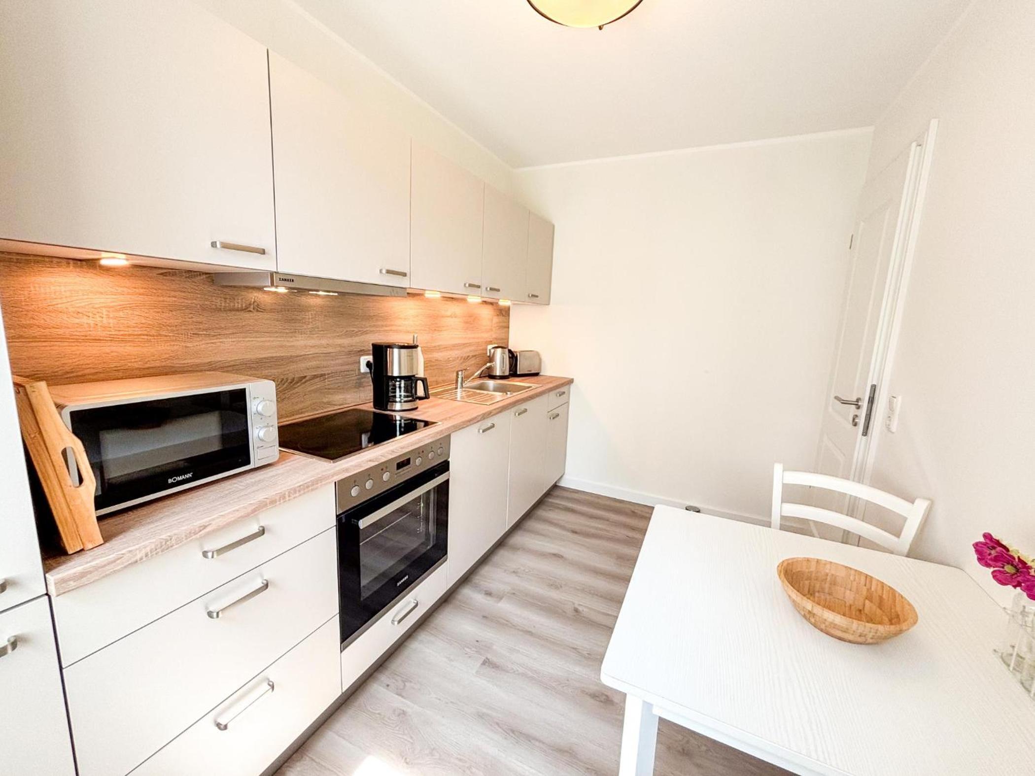 Großzügige Whg. mit verglaster Veranda, geschützter Terrasse