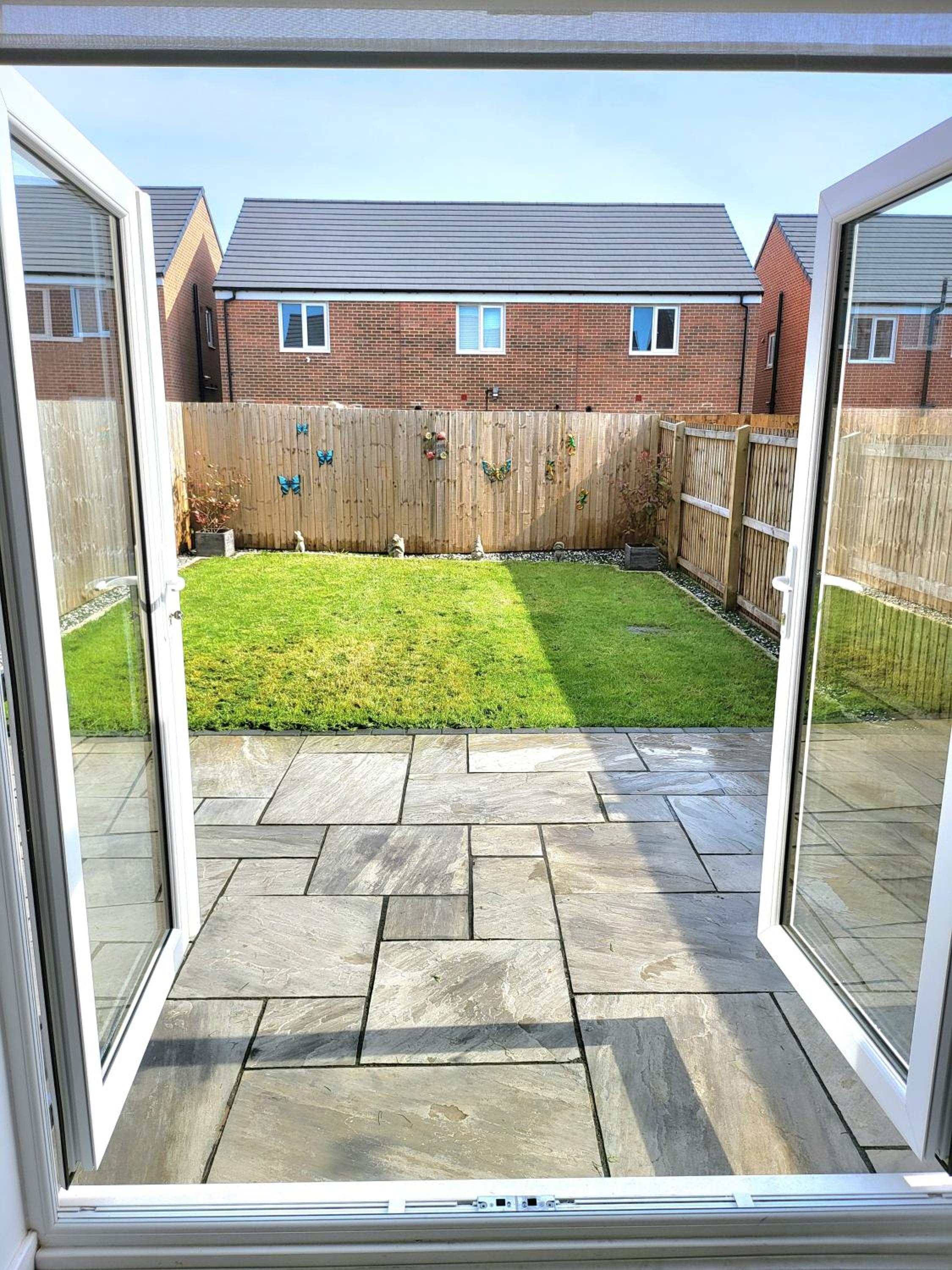 Seaside beach themed home with garden and driveway view 3