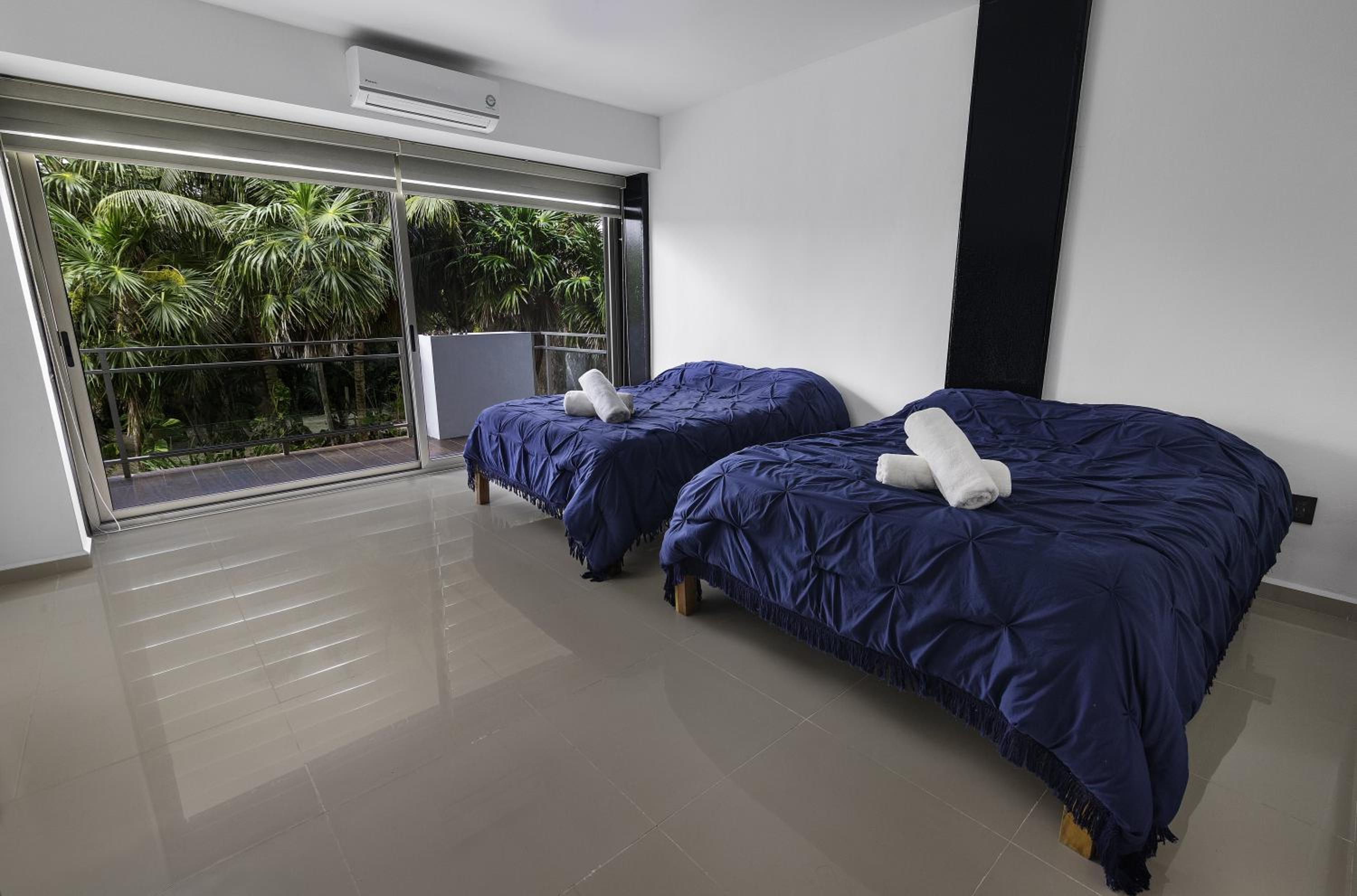 Angelina 28 Beachfront and Family Apartments - Modern and Relaxing Long Stays - 20 min from Cancun Airport