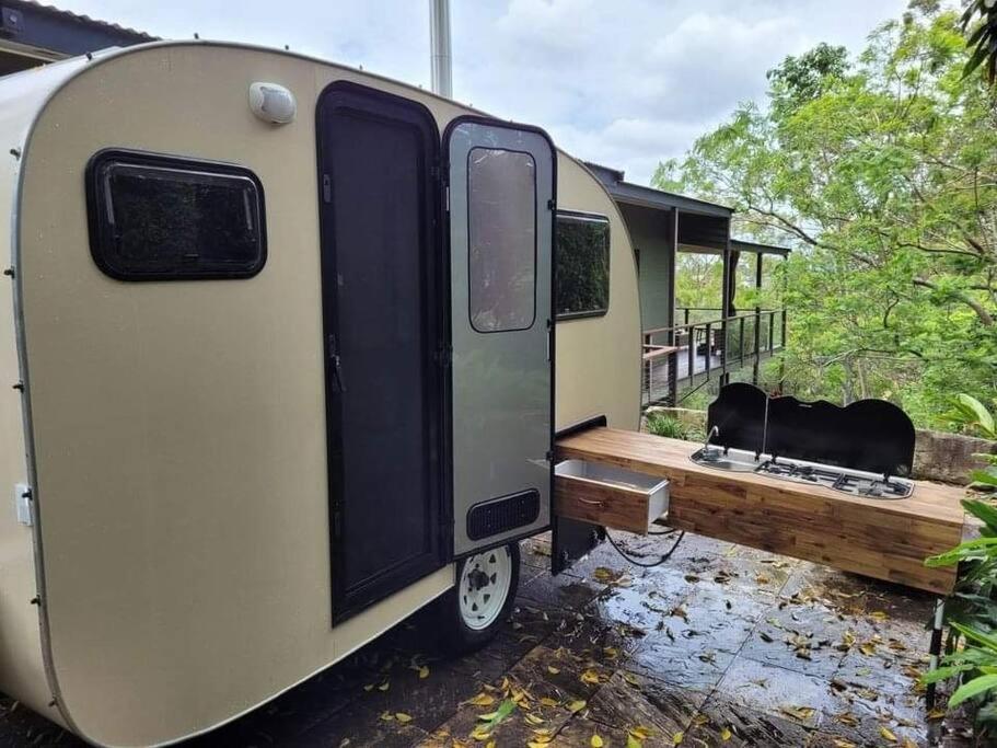 House and Van on the River