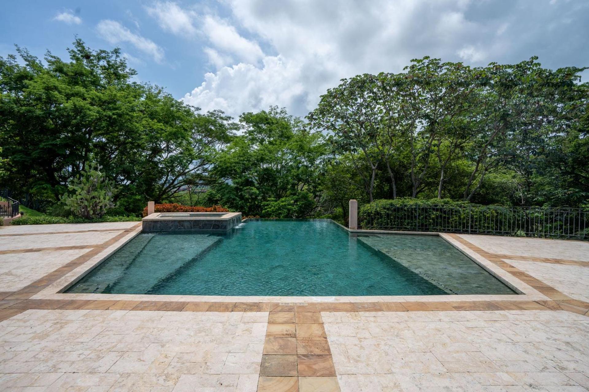 Stunning Luxury Penthouse in Exclusive Beachfront Community with Resort-Style Amenities & Sweeping Views of the Ocean & Golf Course