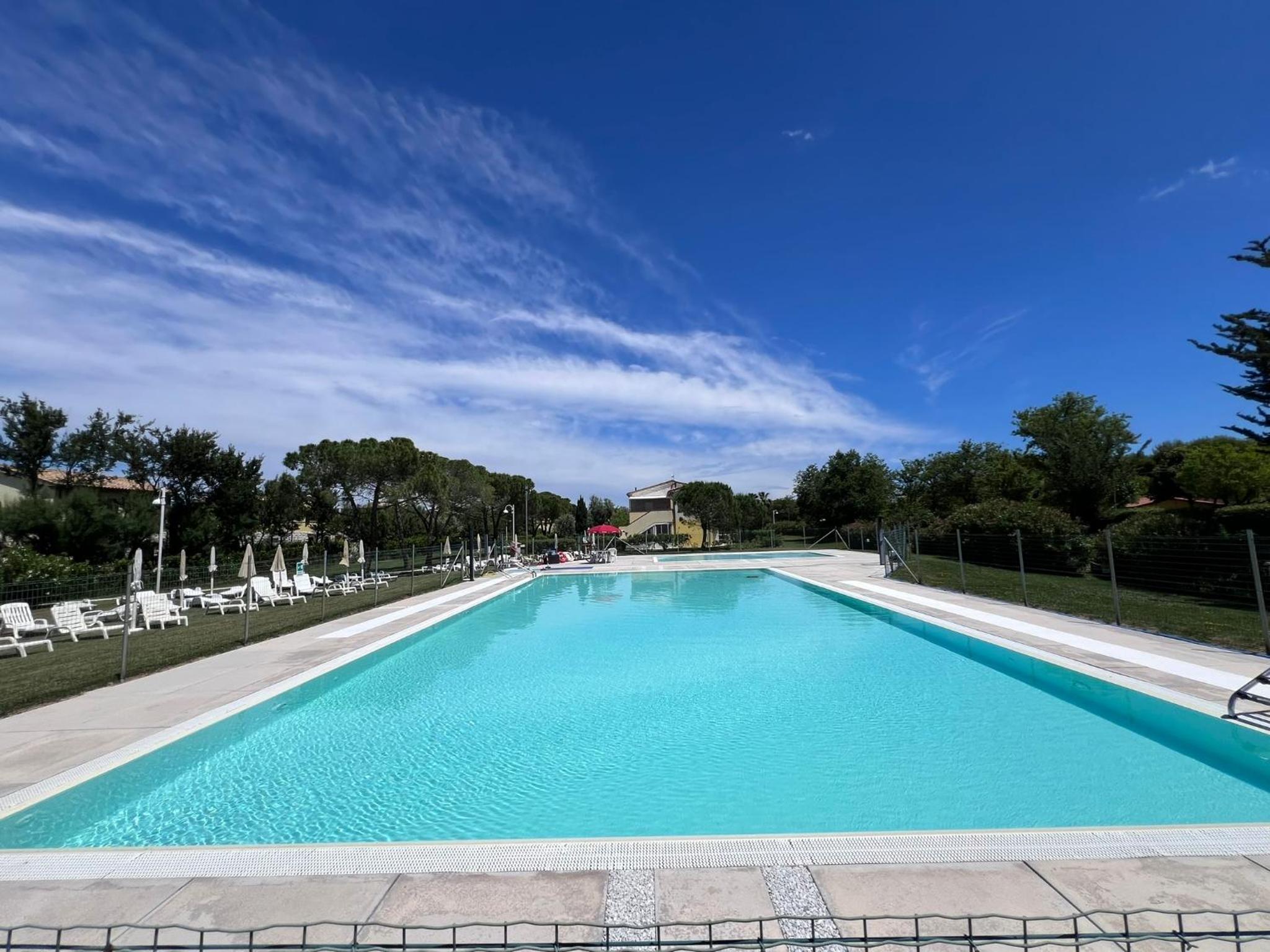 Casa Antia, nuovo bilocale con giardino in Residence con piscina