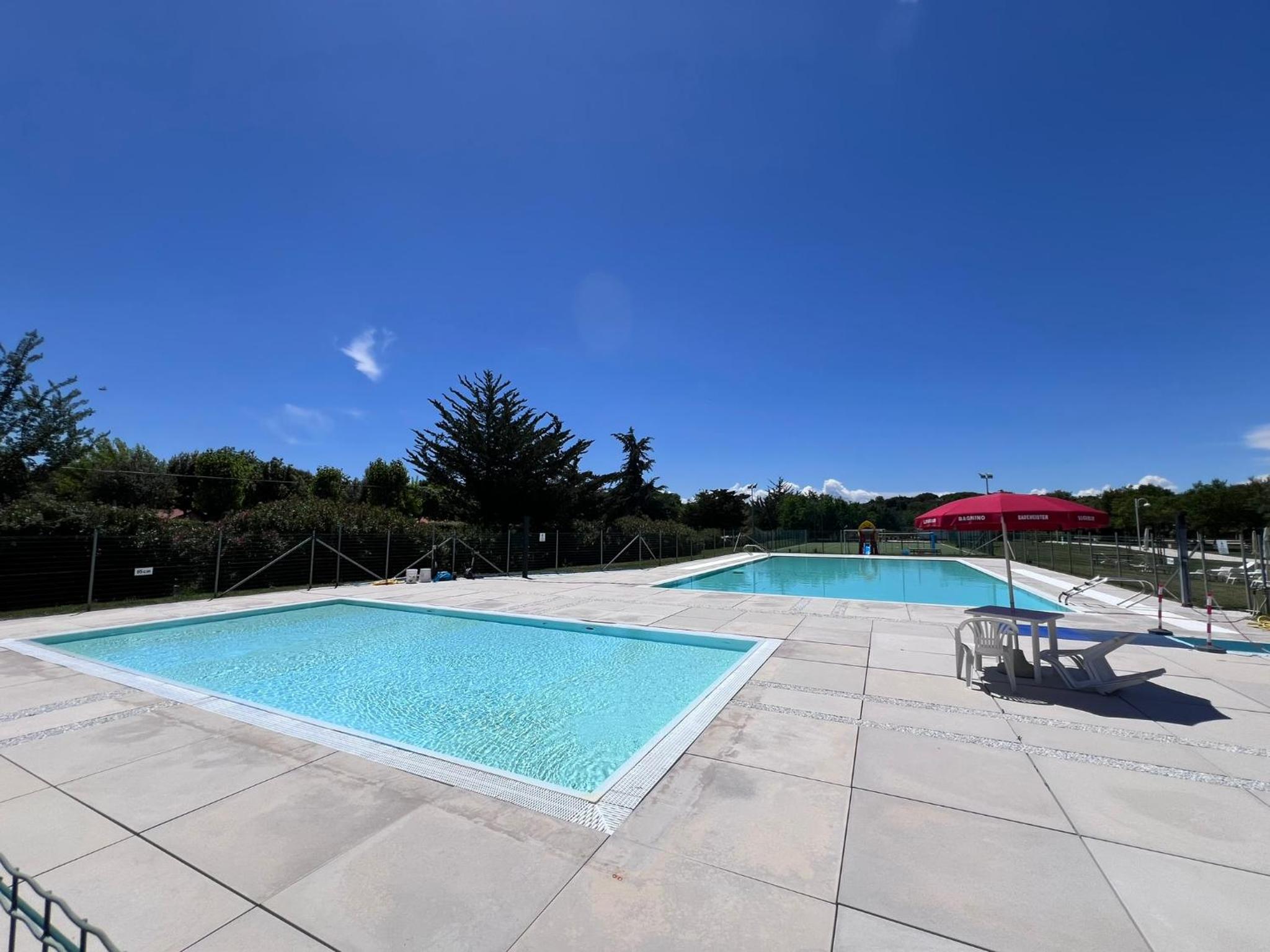 Casa Antia, nuovo bilocale con giardino in Residence con piscina