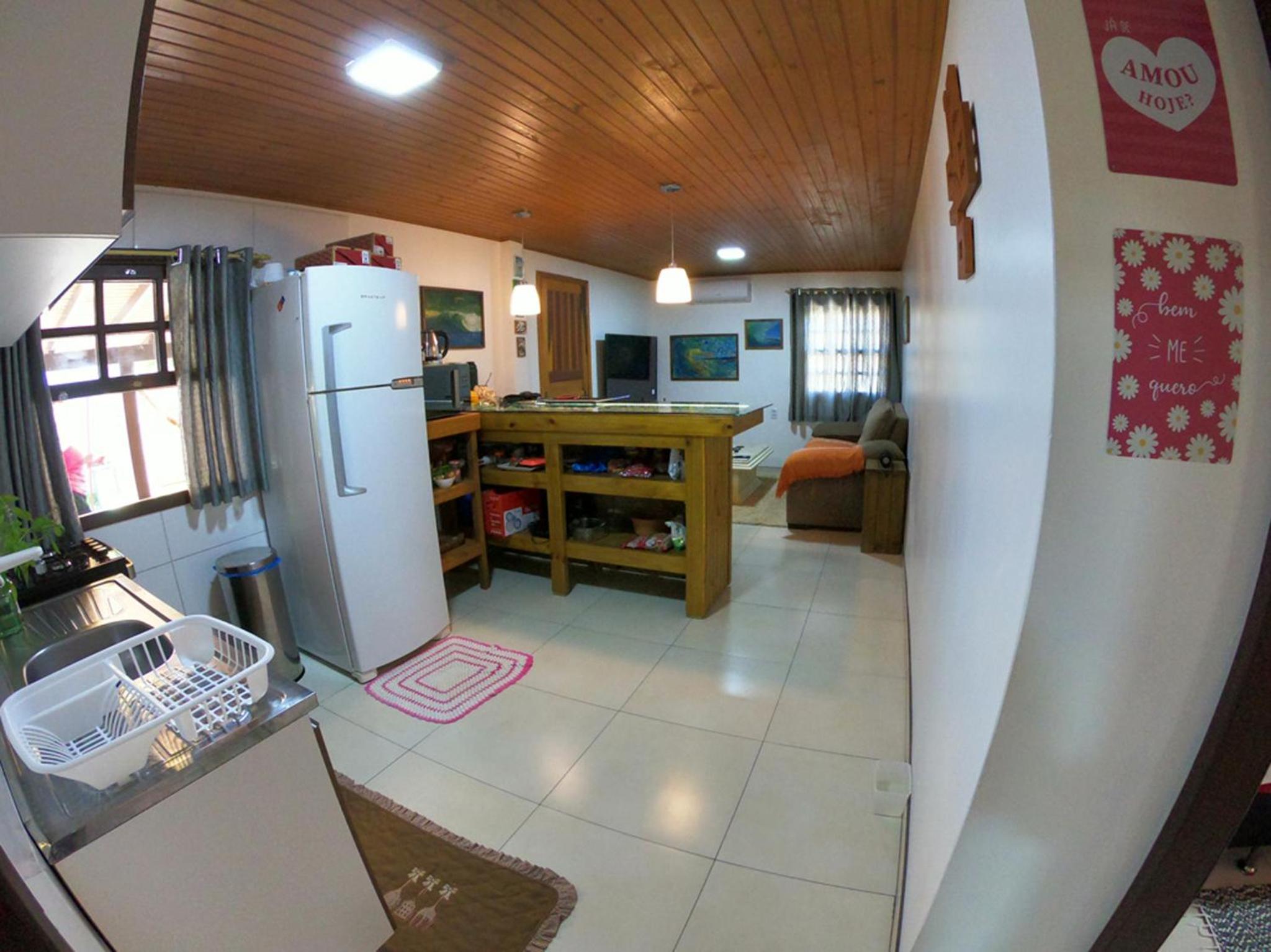 Casa privativa com piscina na Praia da Ferrugem duas quadras mar REF 100