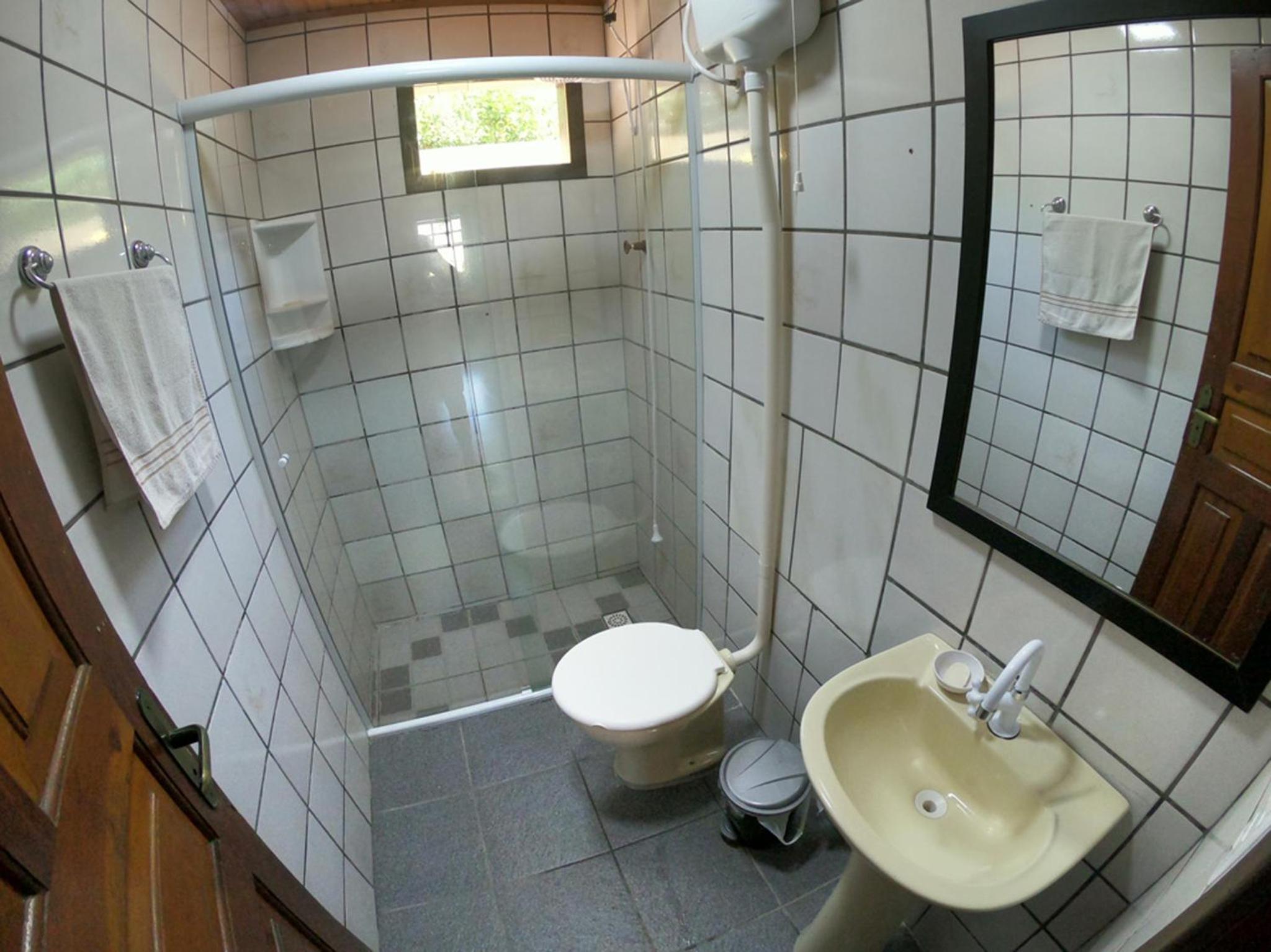 Casa privativa com piscina na Praia da Ferrugem duas quadras mar REF 100