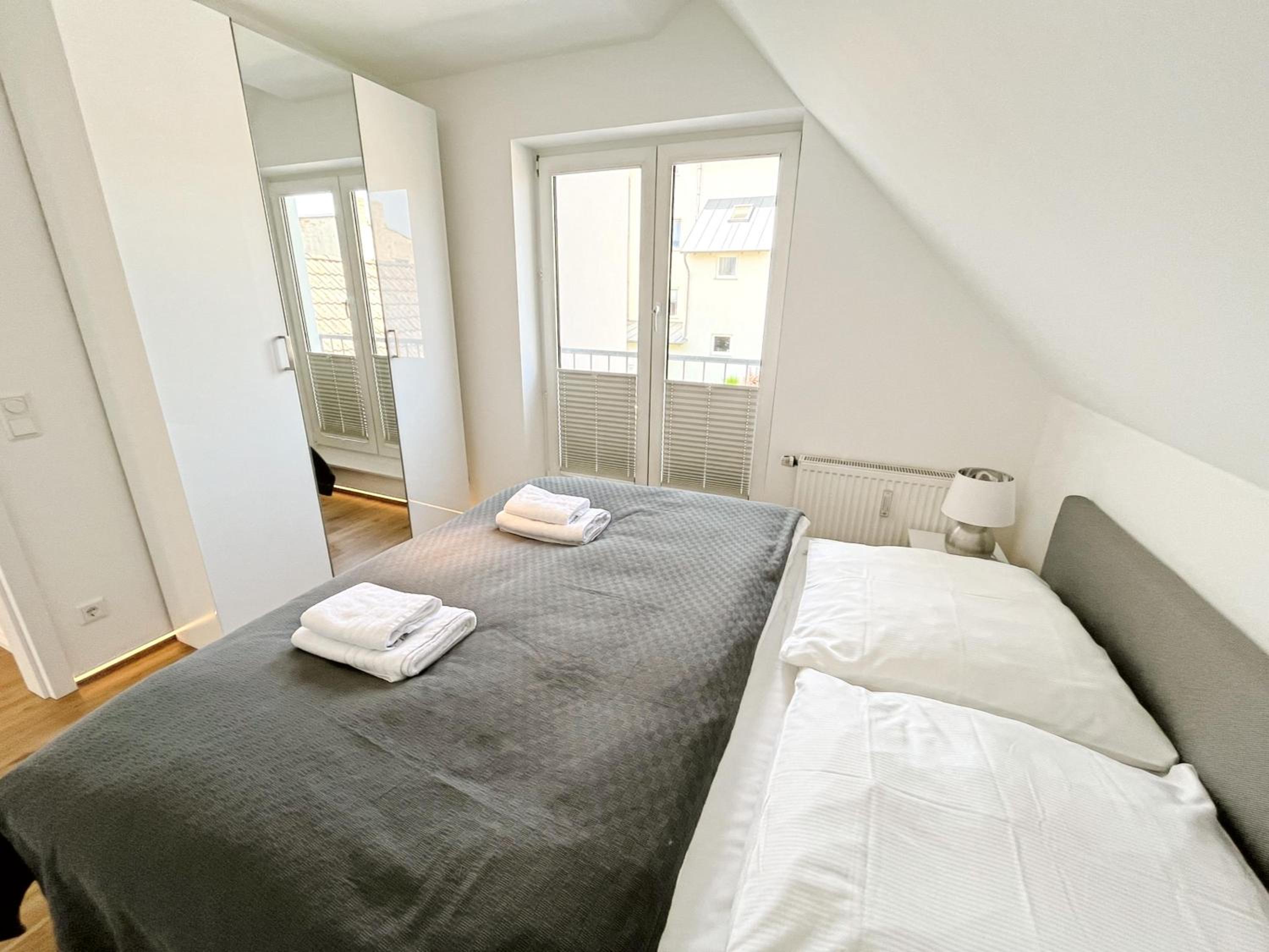 LIGHTHOUSE HOMES - moderne Ferienwohnungen mit Terrasse am Kirchenplatz
