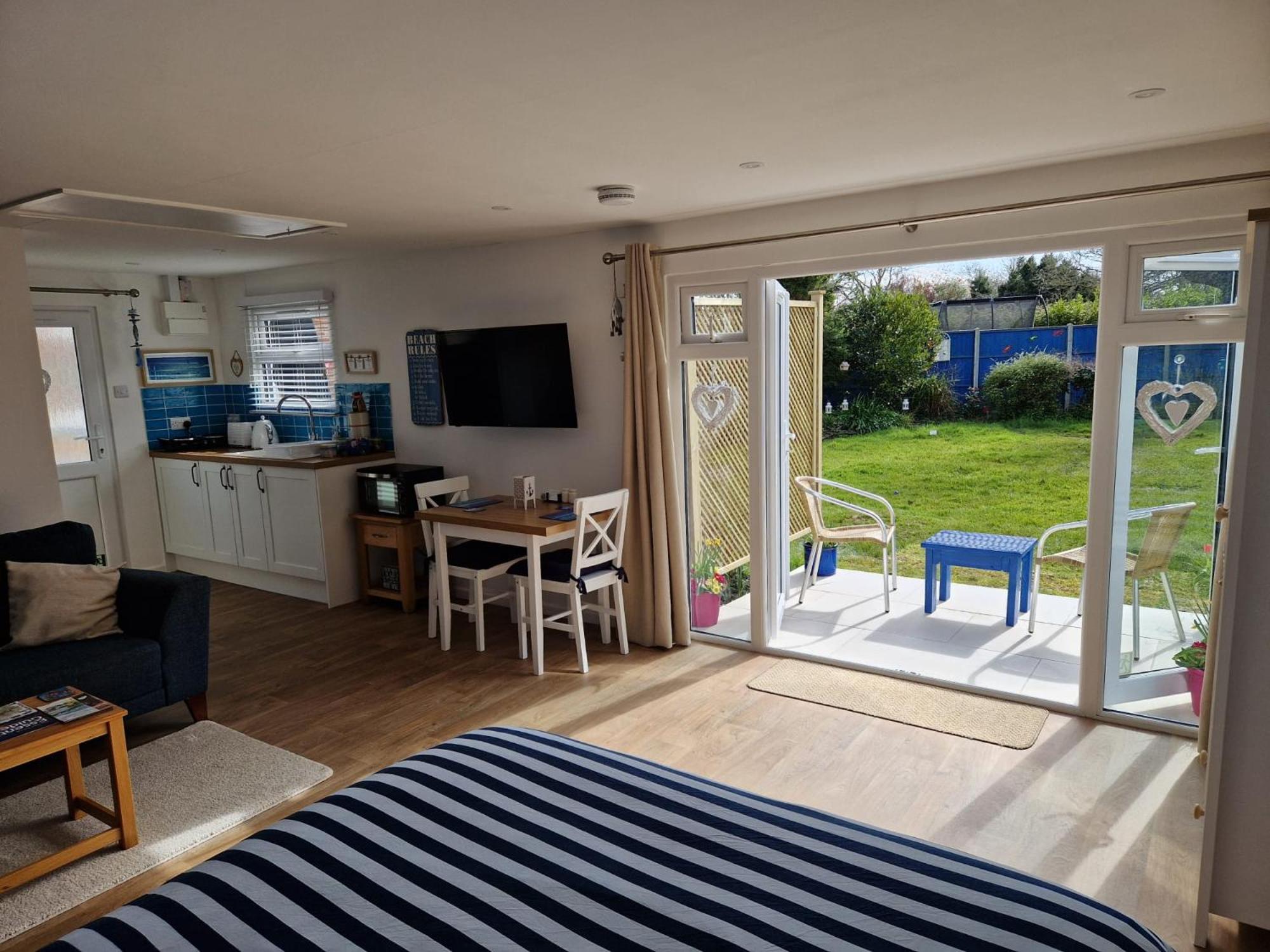 Nautical themed Guest House with patio and treehouse view 2