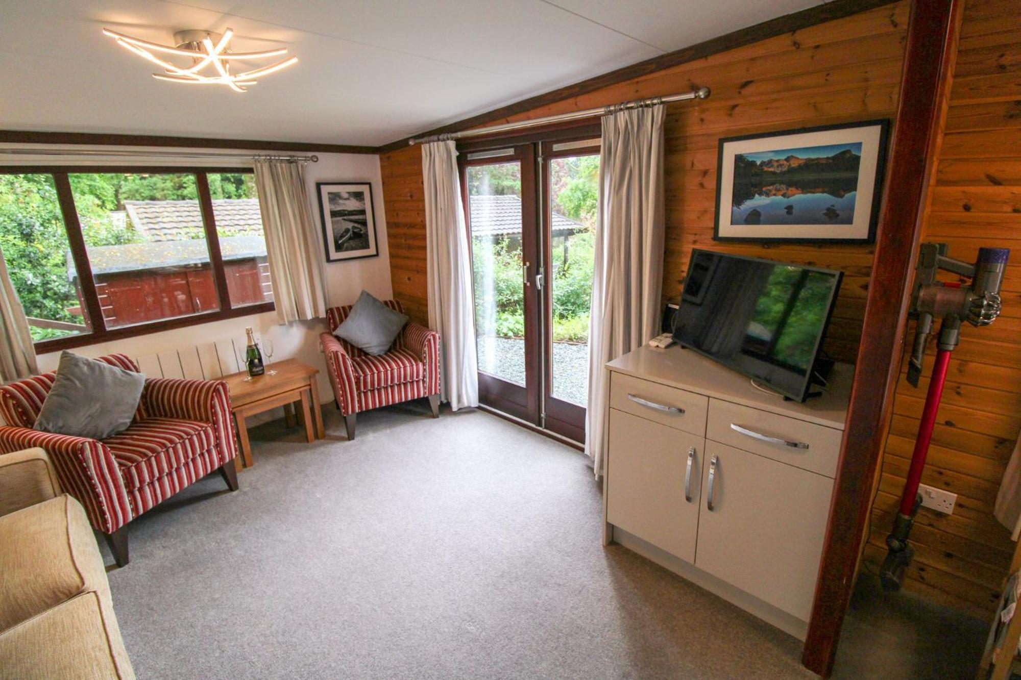 Neaum Crag Lodge ideal for a couple or family with young children in a woodland setting at Skelwith Bridge view 3