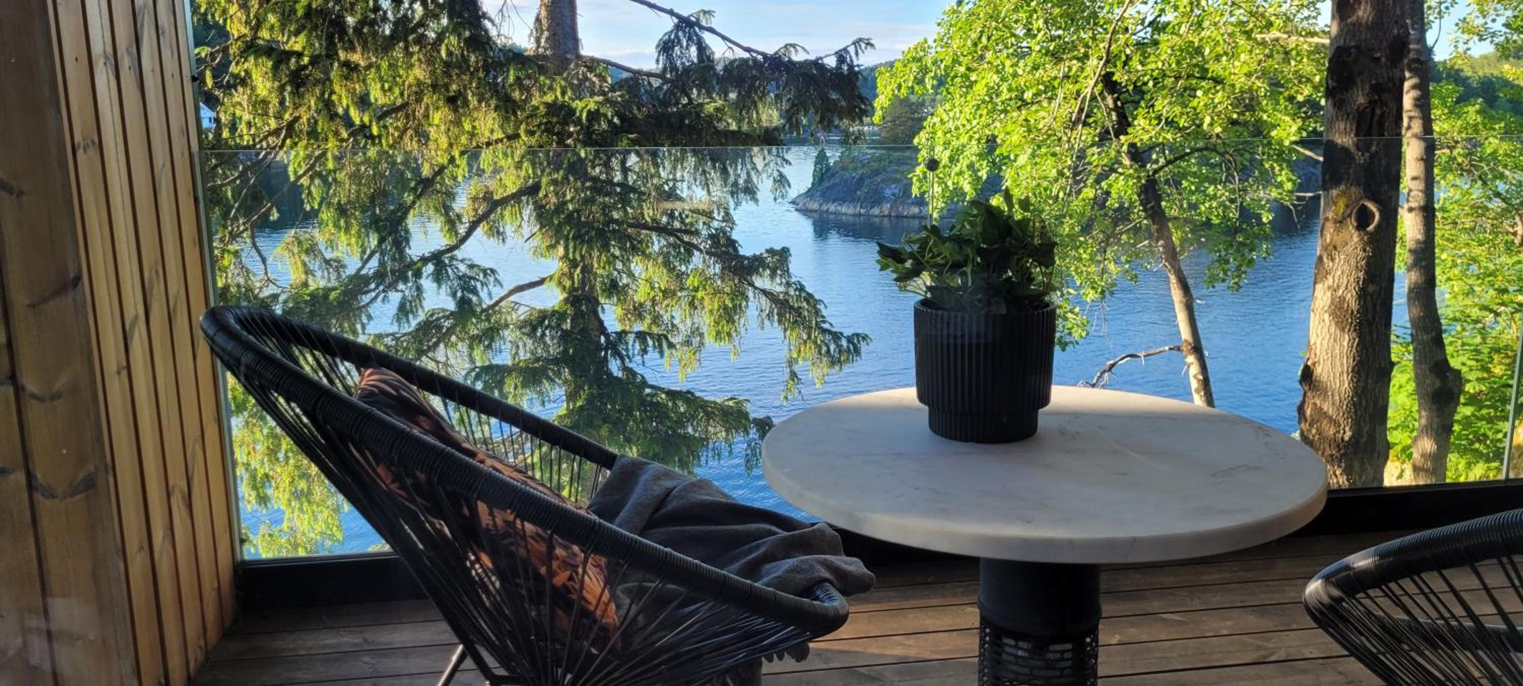 Moderne hytte i vannkanten med tilgang til brygge og båt view 5