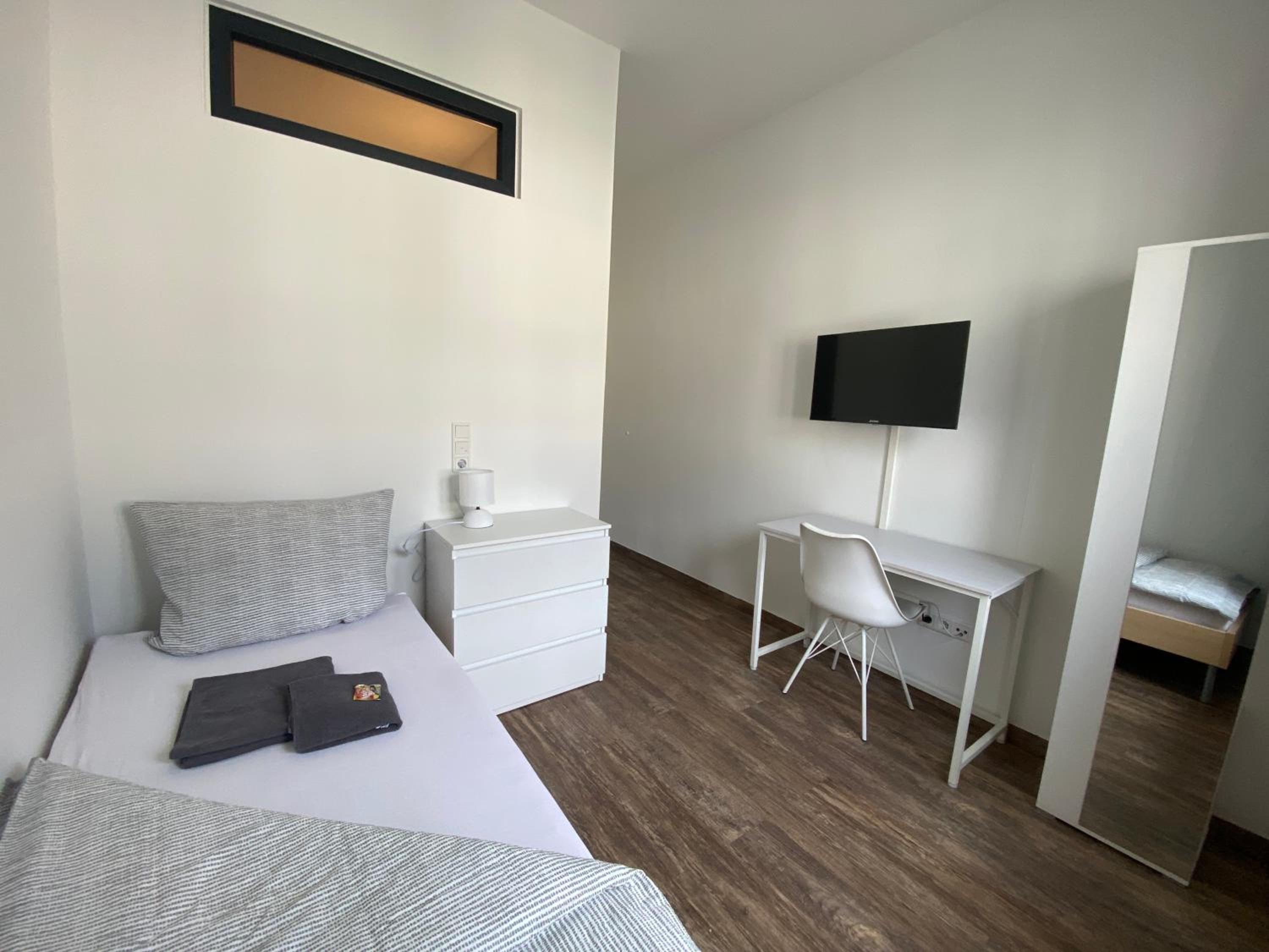 BIELEFELD CITY APARTMENTS - komfortable Einzelzimmer und Doppelzimmer - moderne Badezimmer, schnelles WLAN, Self-Check-In