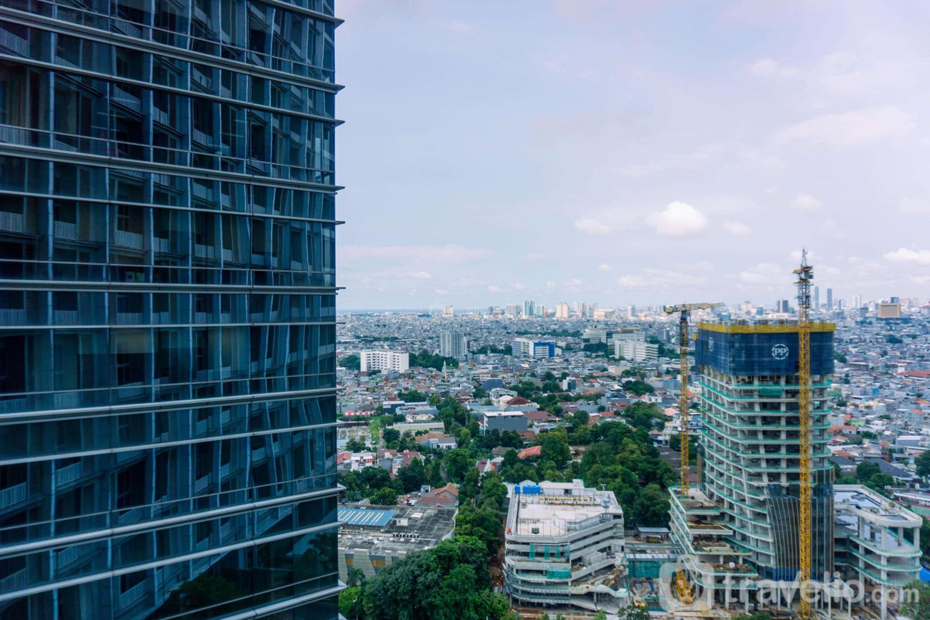 Modern Look and Spacious 1BR at Neo Soho Apartment By Travelio