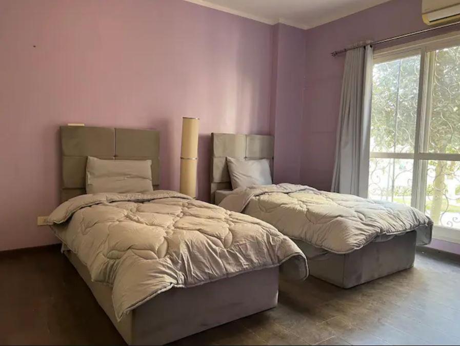 2BR Apartment with Private Garden in Downtown Rehab Near Malls