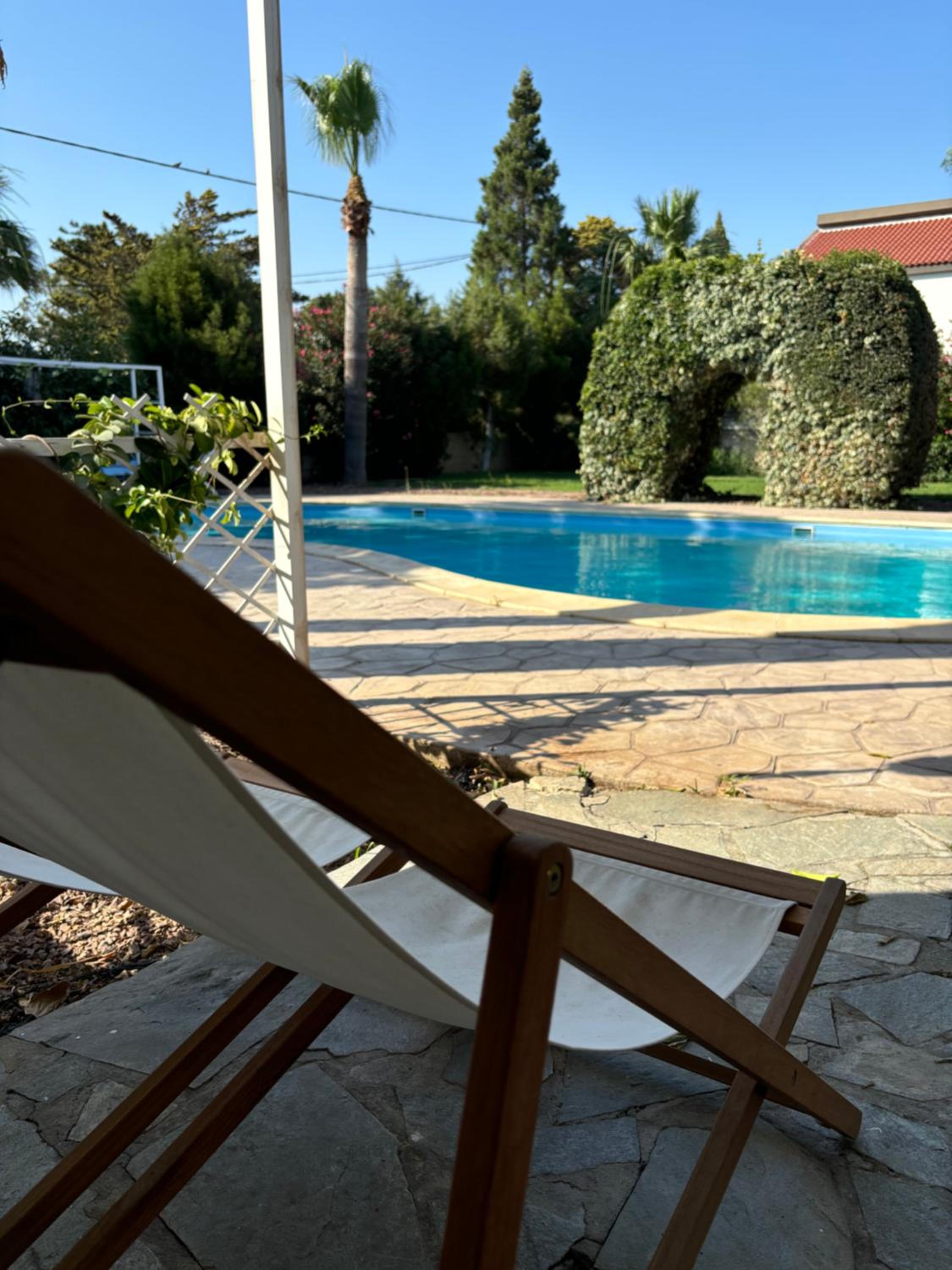 Mediterranean poolside garden cottage