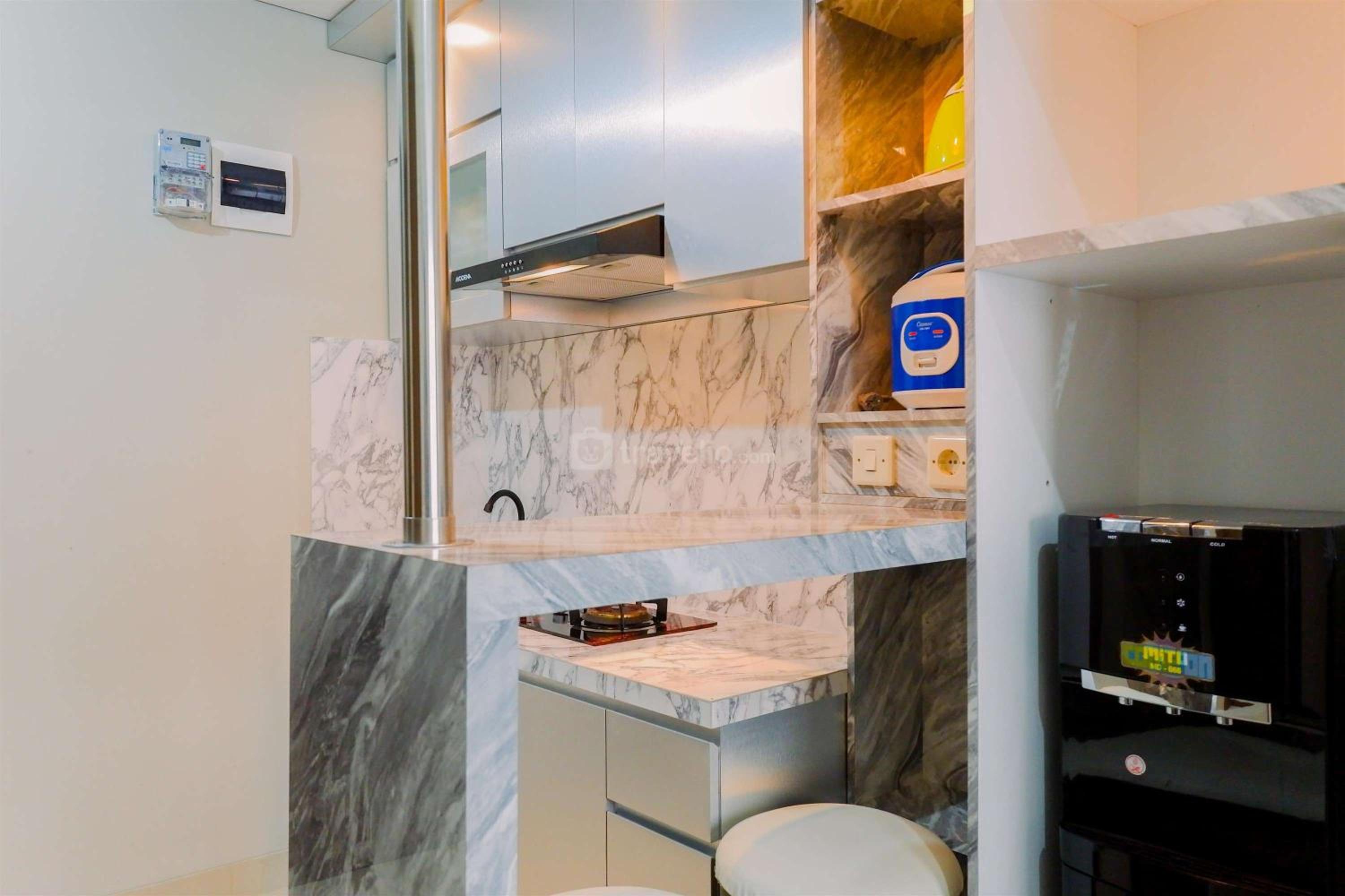 Homey and Minimalist 1BR Royal Sentul Park Apartment By Travelio
