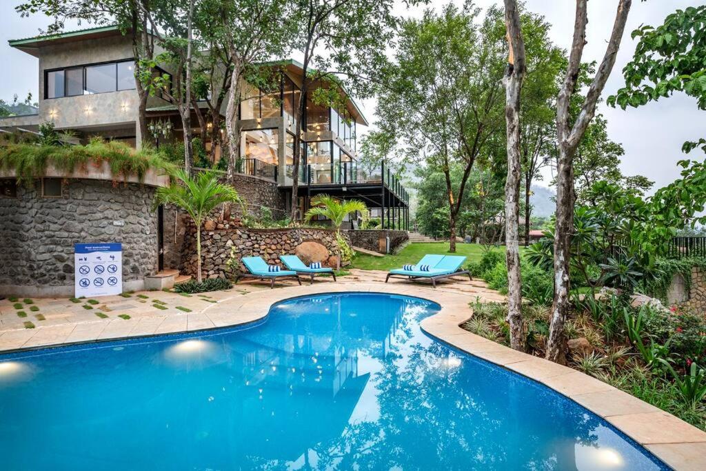 SaffronStays Sonnet - 4BR veg pool villa with grand piano, theater, lawn & mountain views near Mumbai