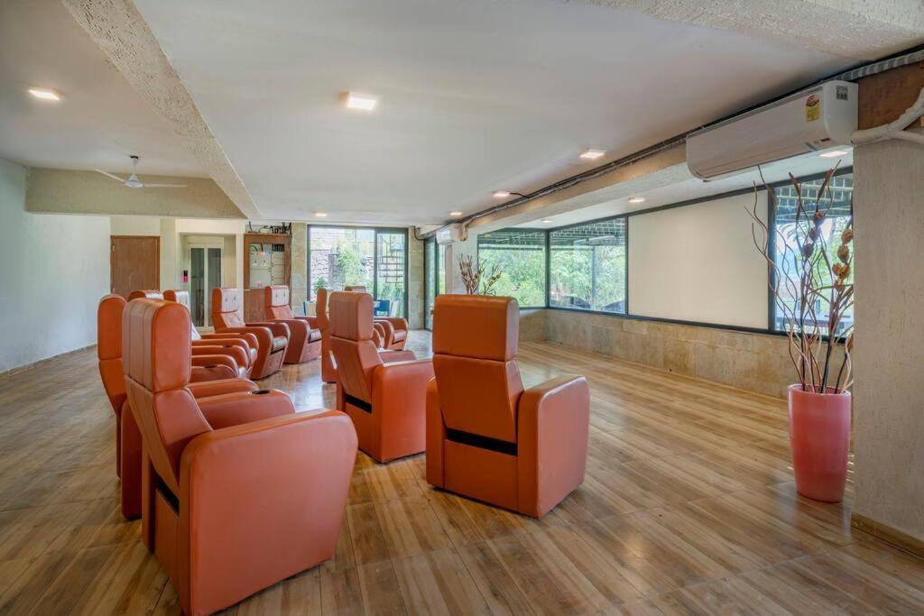 SaffronStays Sonnet - 4BR veg pool villa with grand piano, theater, lawn & mountain views near Mumbai