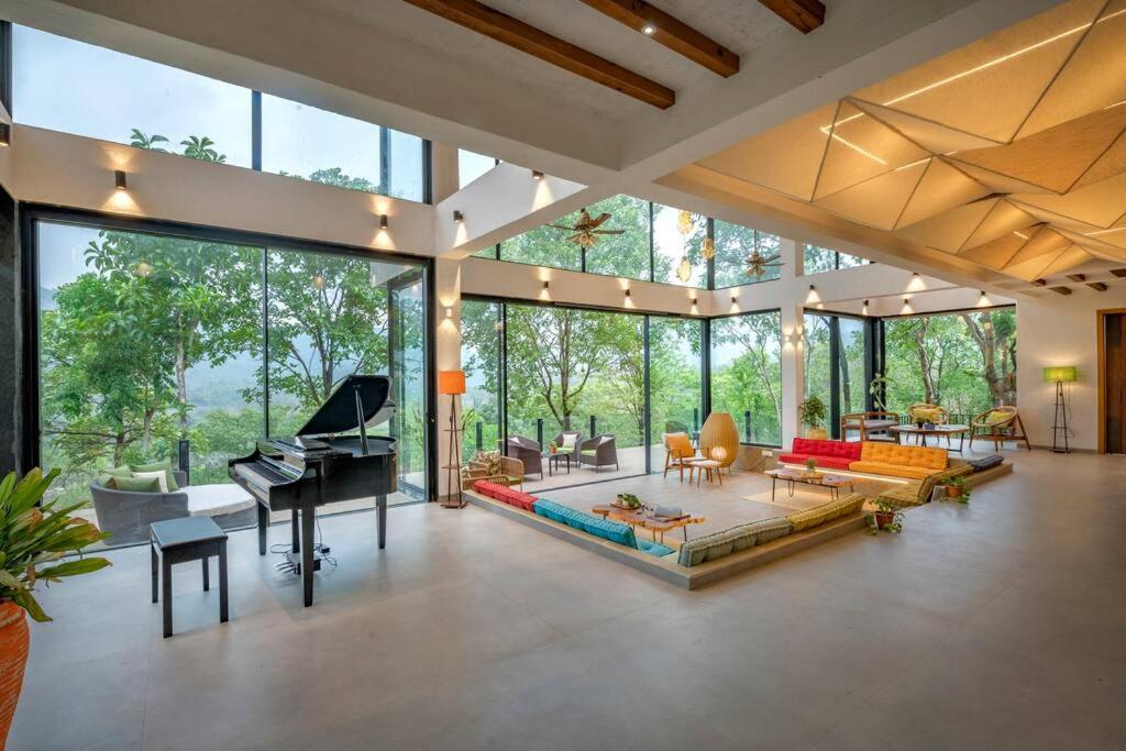 SaffronStays Sonnet - 4BR veg pool villa with grand piano, theater, lawn & mountain views near Mumbai