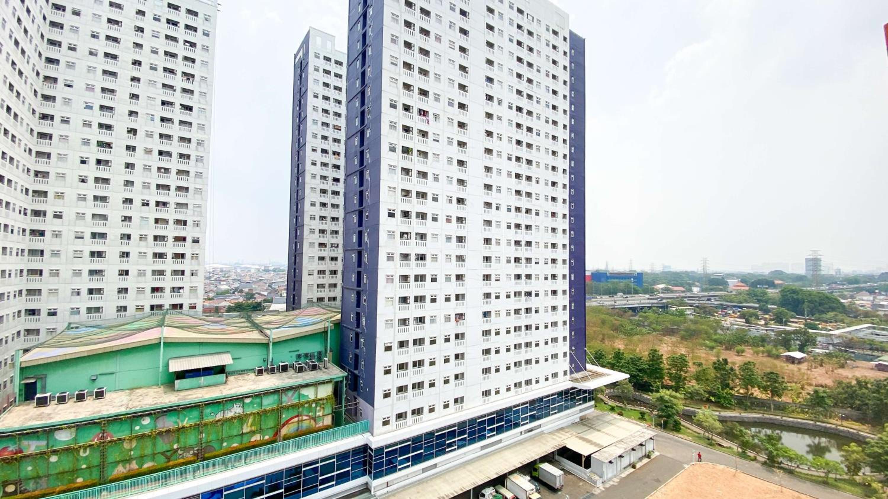 Modern and Classic 2BR at Green Pramuka City Apartment By Travelio view 5