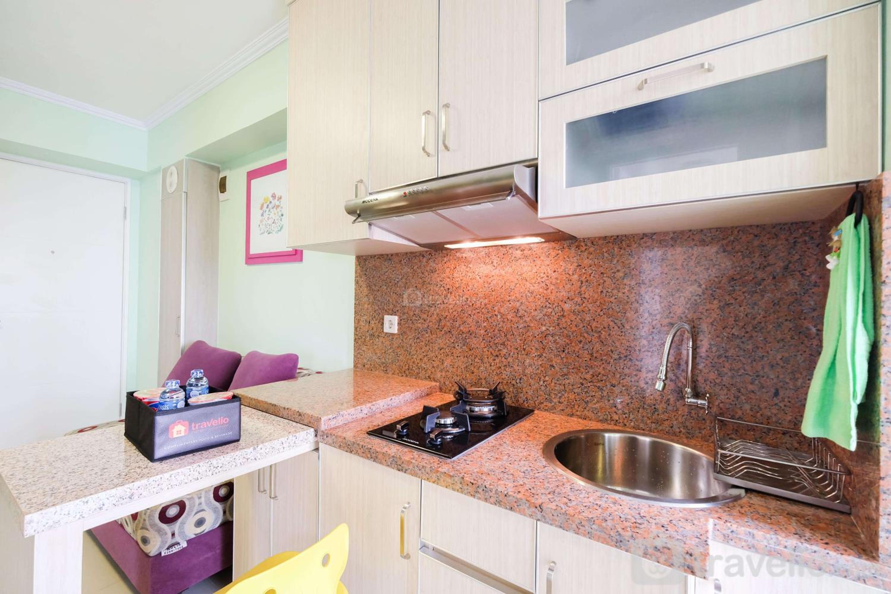 Cozy 2BR Bassura City Apartment By Travelio