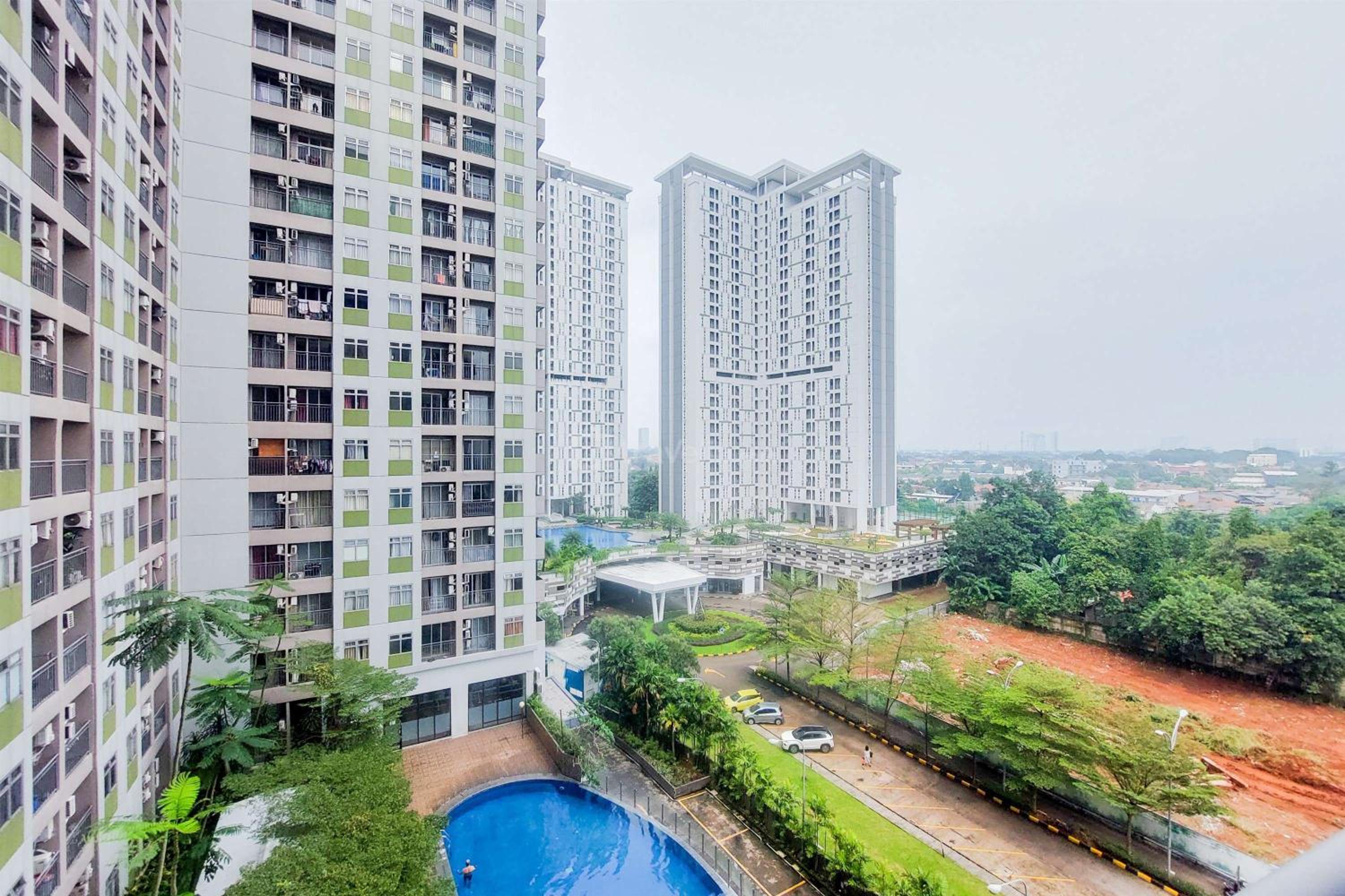 Modern Look 2BR at Serpong Greenview Apartment By Travelio