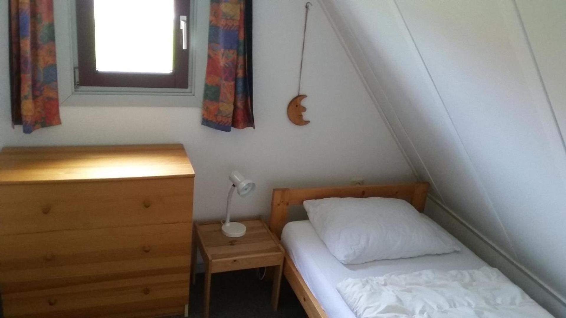 Gemütliches Ferienhaus mit Garten und einer Terrasse mit Windfang