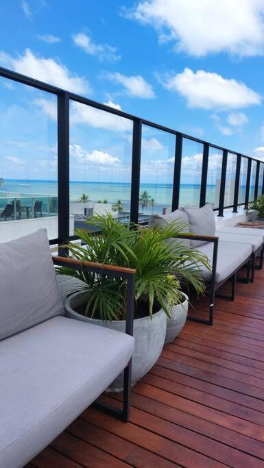 Flat charmoso a beira mar no Get One