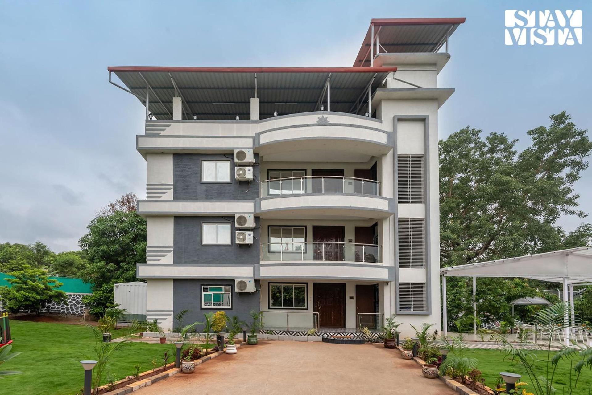 Grey Hues with Swimming Pool & Lawn at Karjat by StayVista view 4
