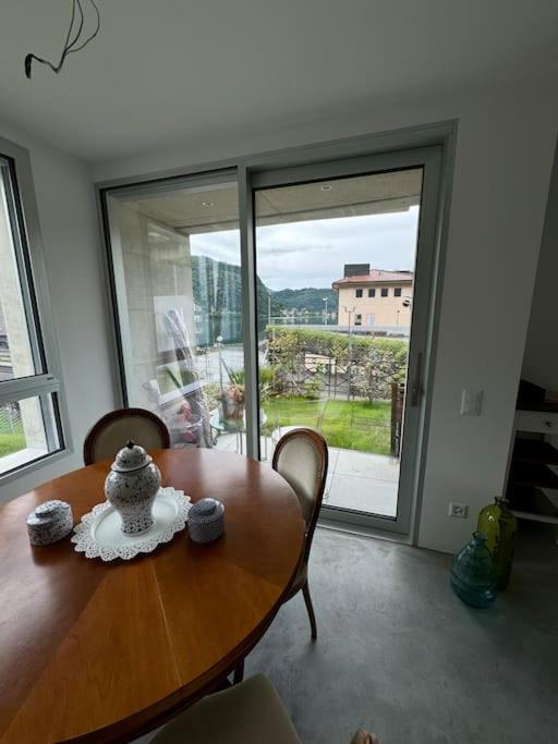 Neue Gartenwohnung mit Sicht auf den Luganersee