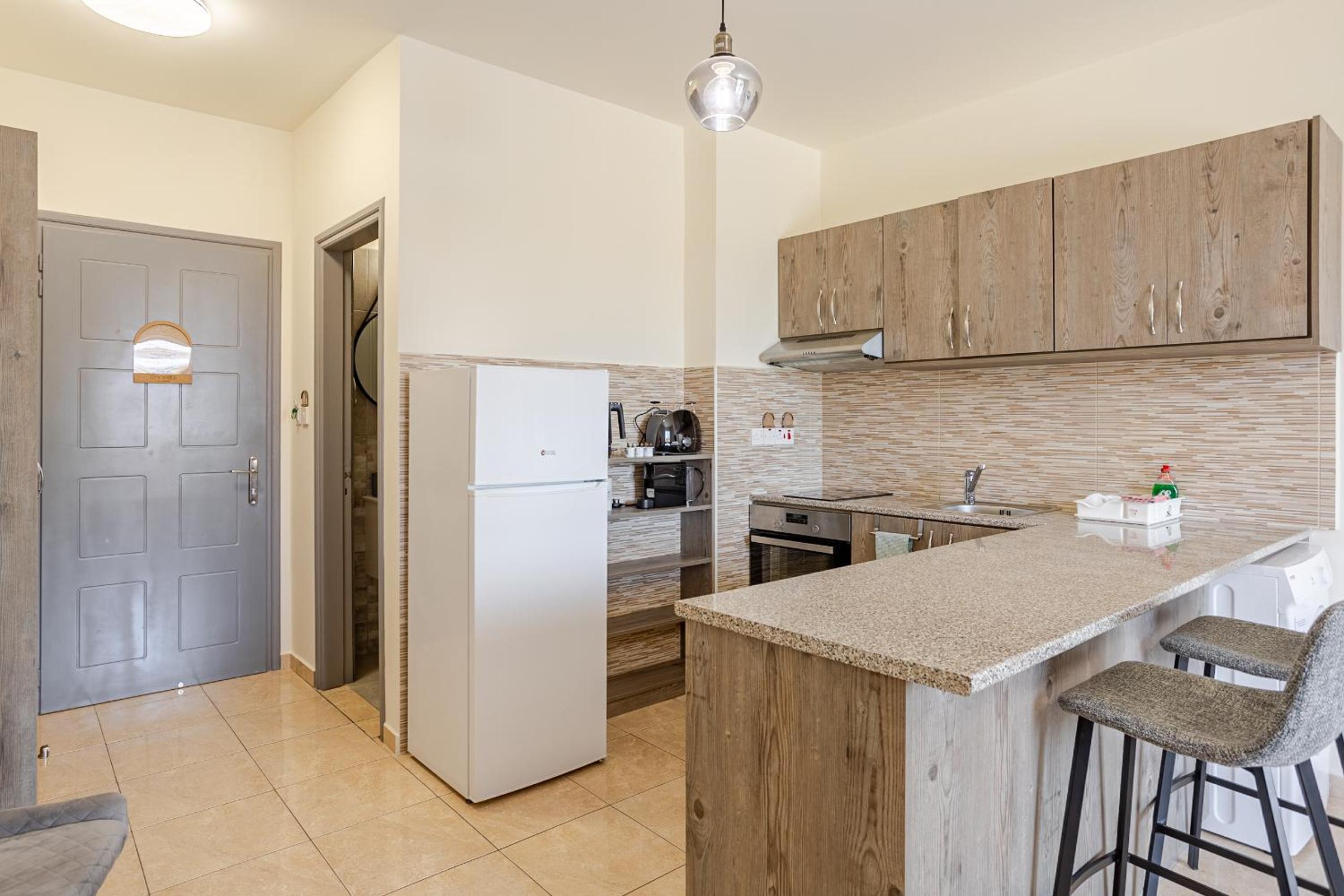 Danaos Seaside Suite 104 with Pool in Tourist Area