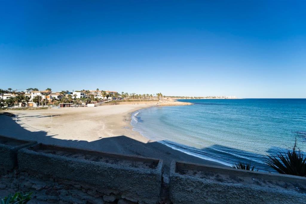 Seaview Bliss - Playa Flamenca Beachfront Bungalow