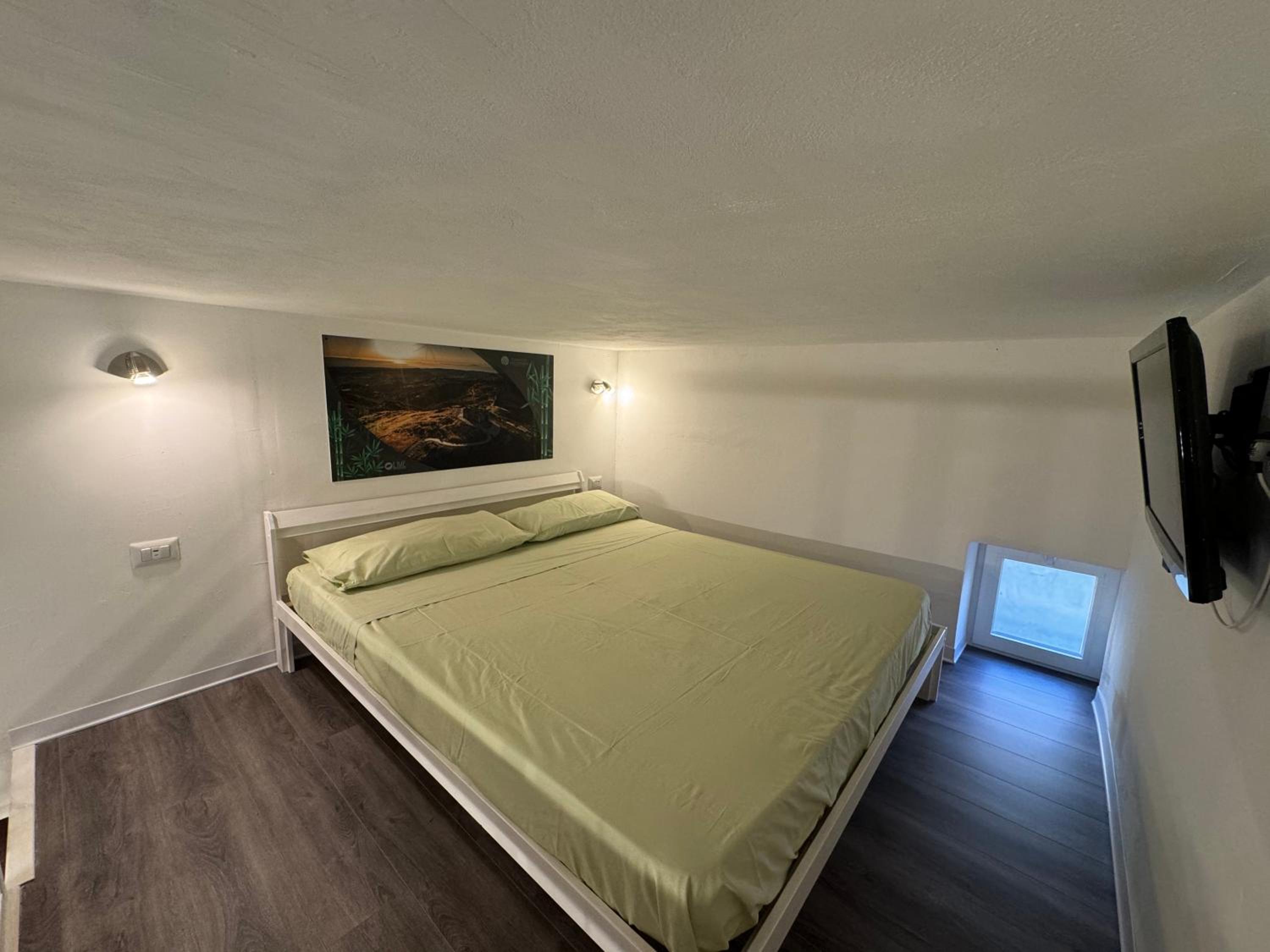 Lime Apartments - BAMBOO en Alghero — hotel room