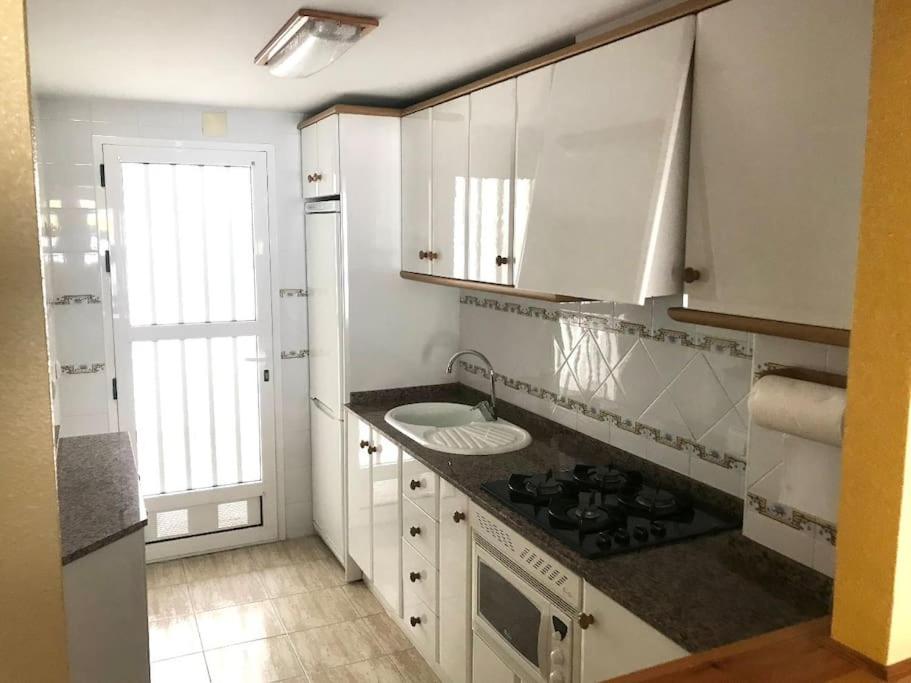 Family apartment with pool in Oliva Nova