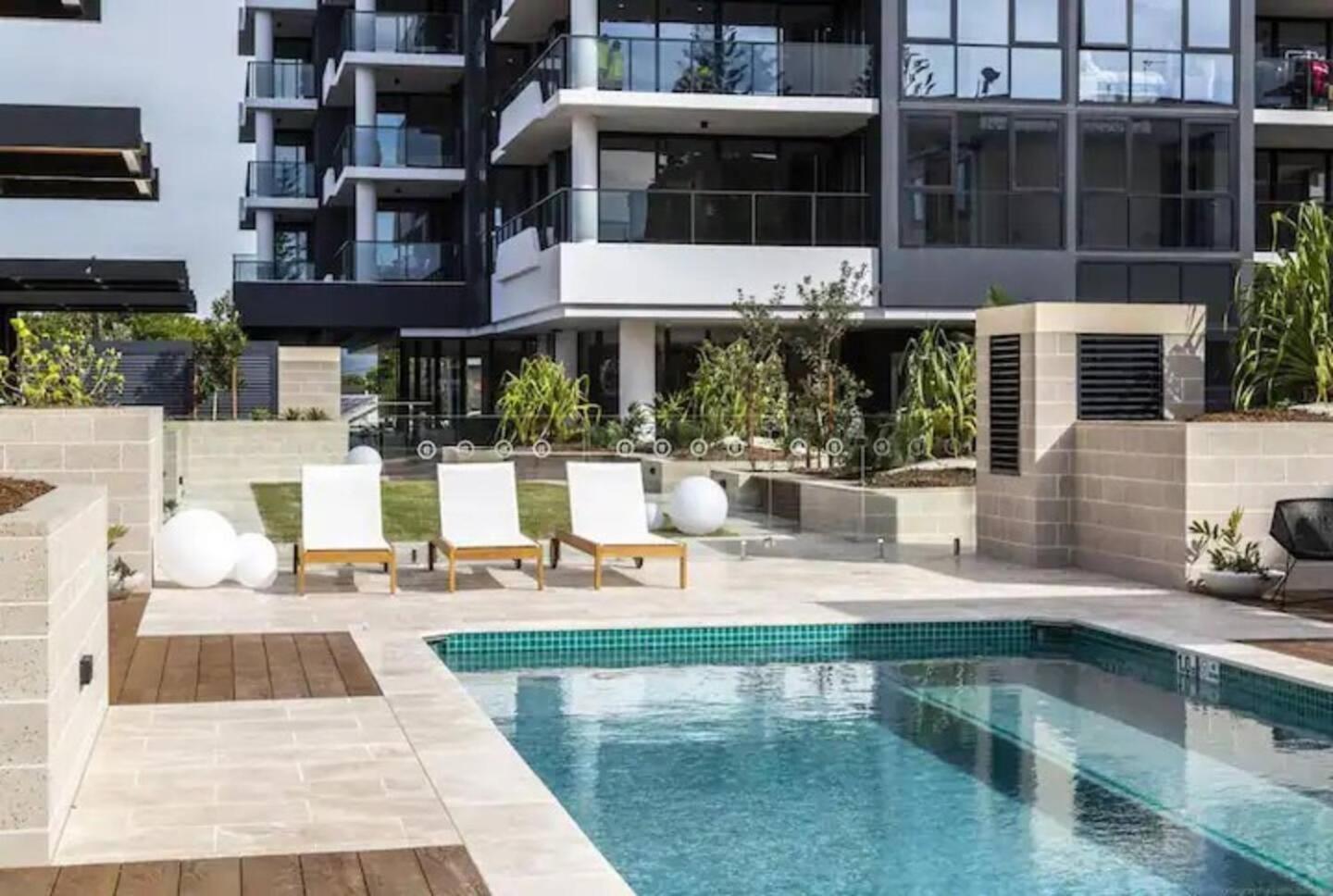 Beach front luxury with two carparks, pool, gym