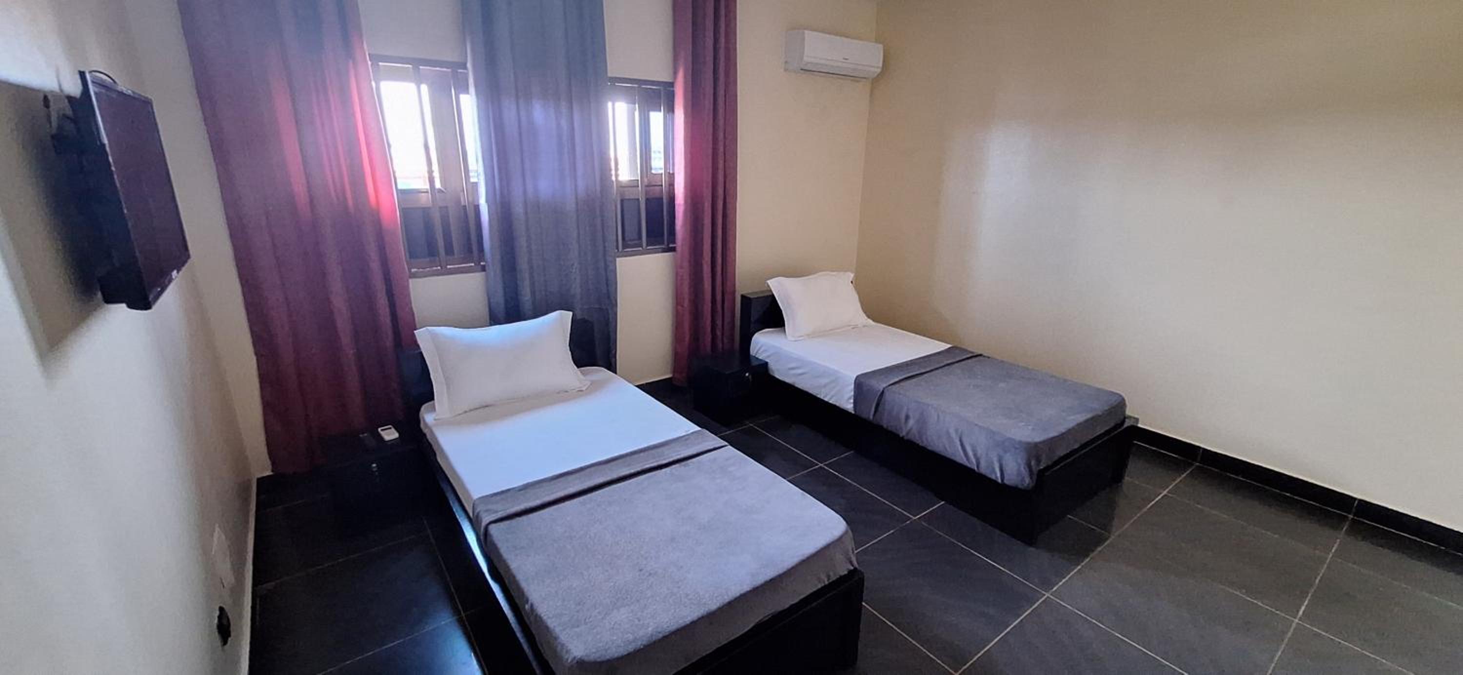 Deluxe Twin Beds Bedroom in Lome Togo