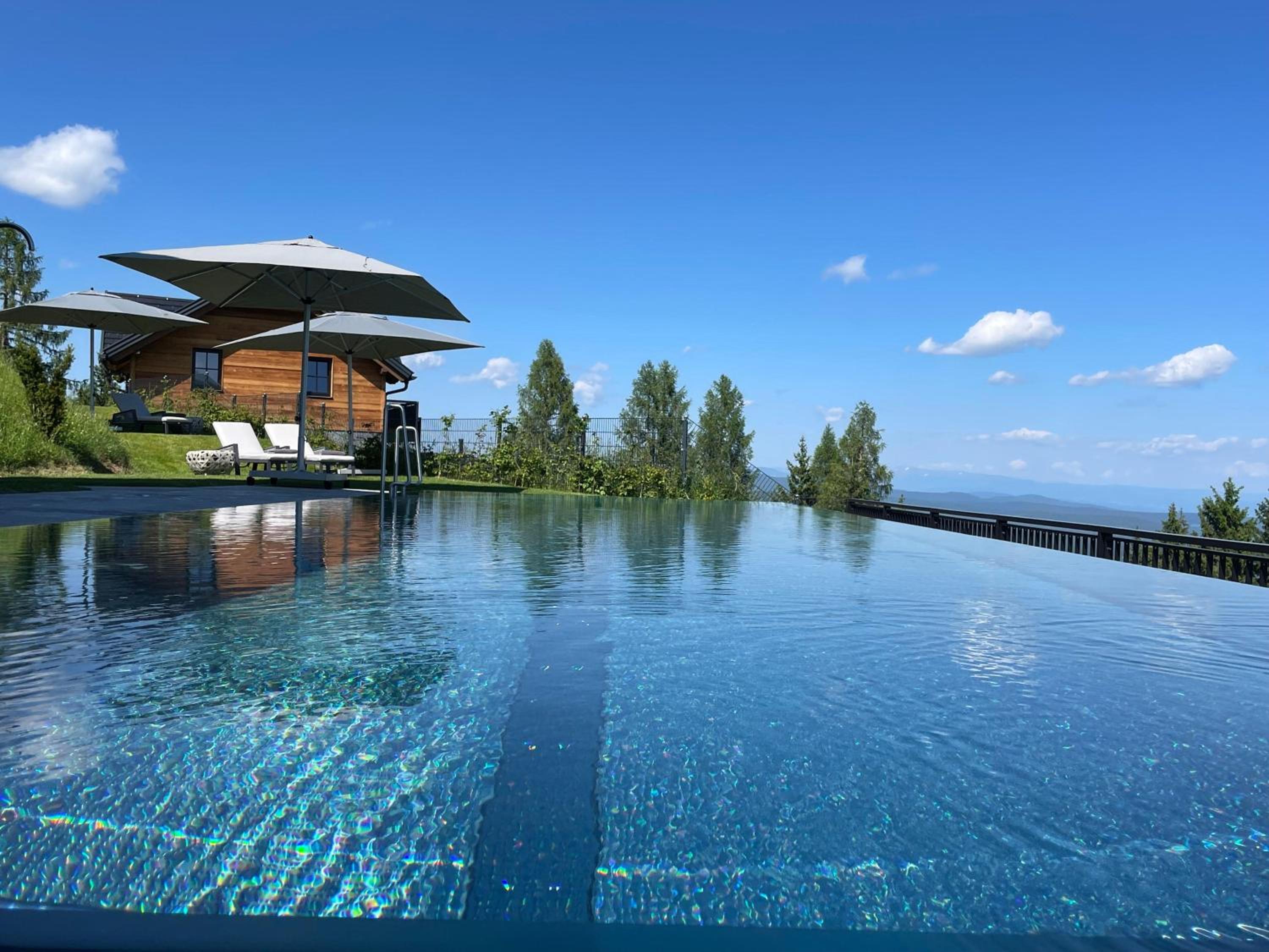 Tomtegl-Bergchalet-No-4-mit-Privatsauna-Infinitypool-Kamin-Fitnessraum-1500m-Seehoehe