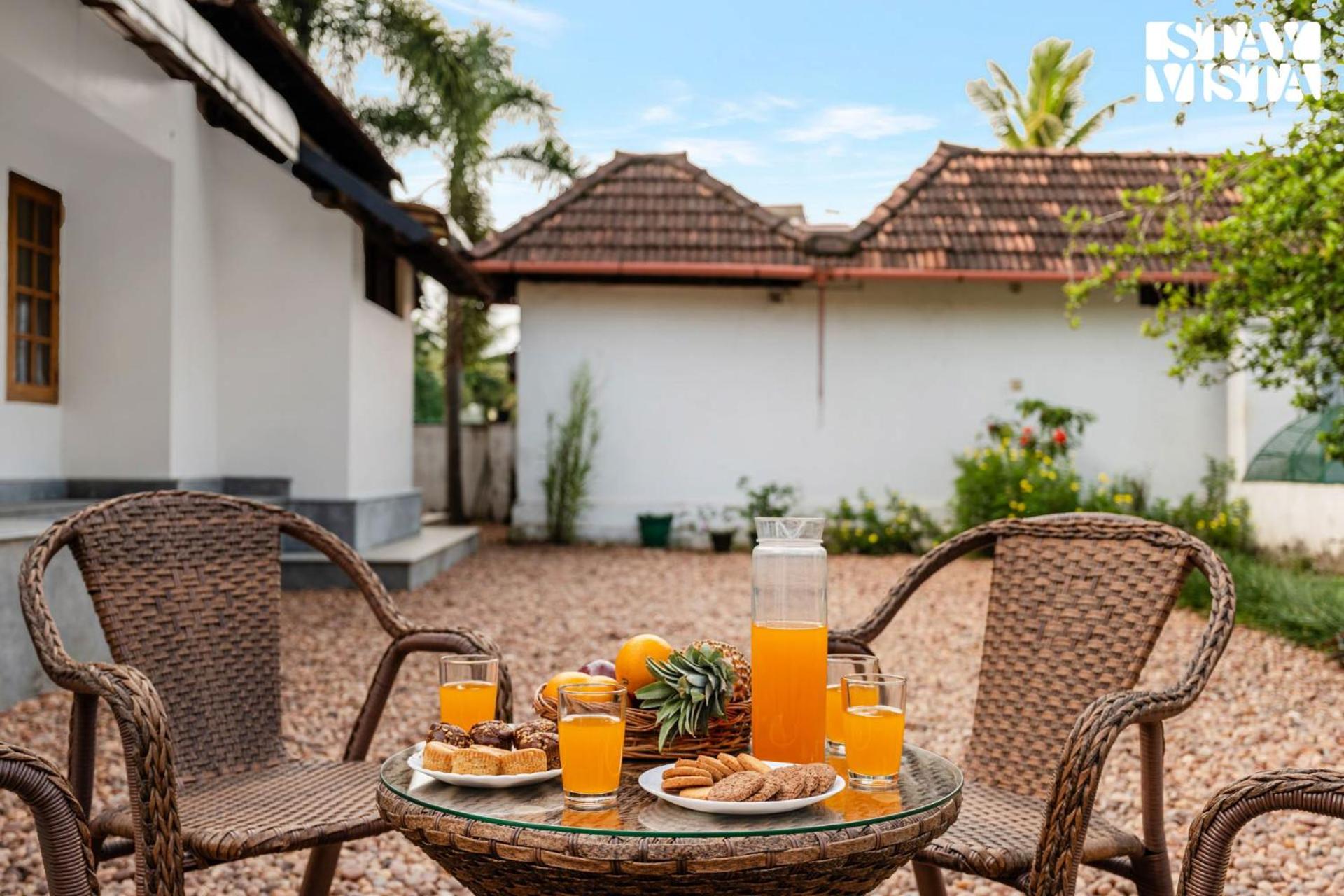 CVM House with Lawn at Thiruvalla by StayVista view 4