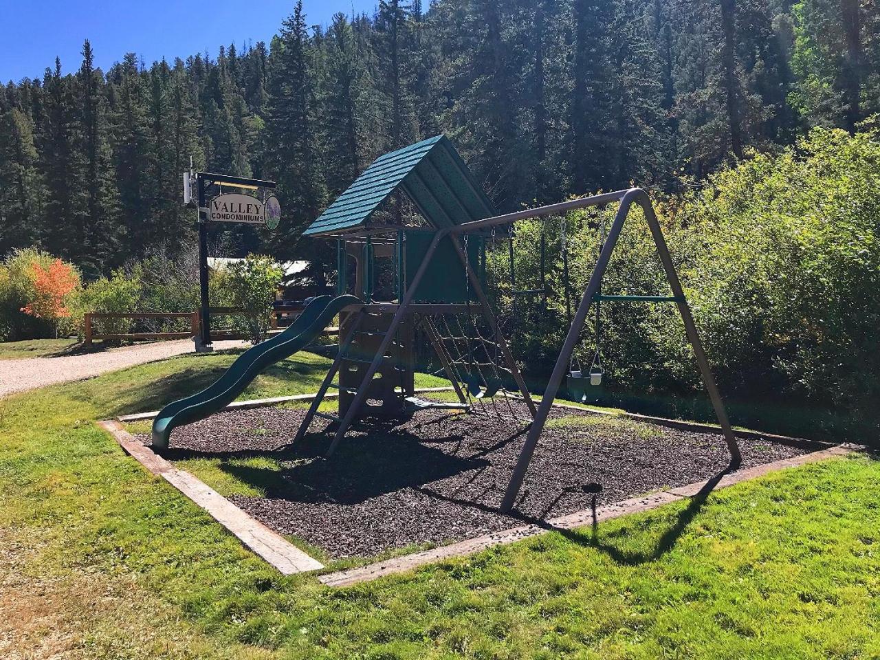 Valley Condo 111 - Dancing Bear Retreat - Creekside - WiFi - Hot Tub - Fireplace - Washer - Dryer - Playground view 5