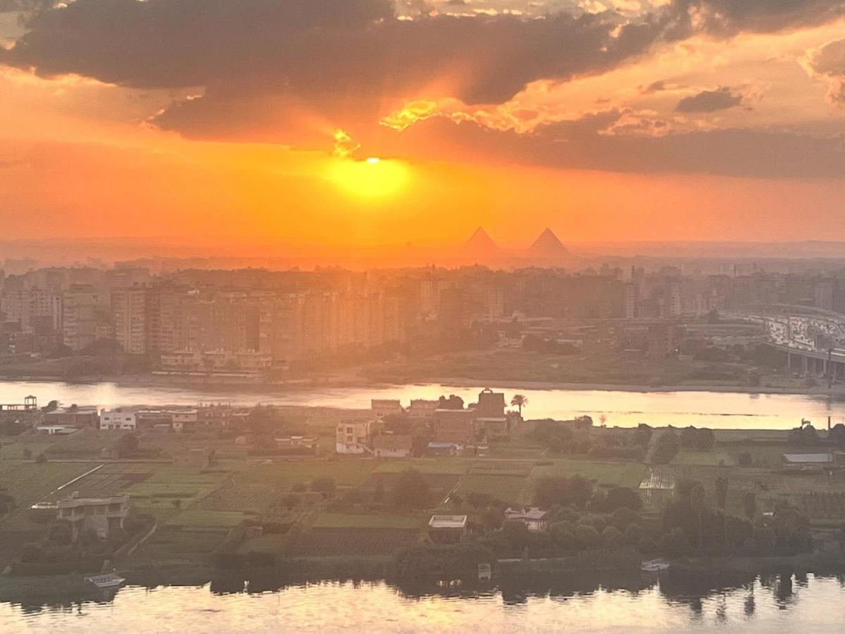 Maadi Nile and pyramids view