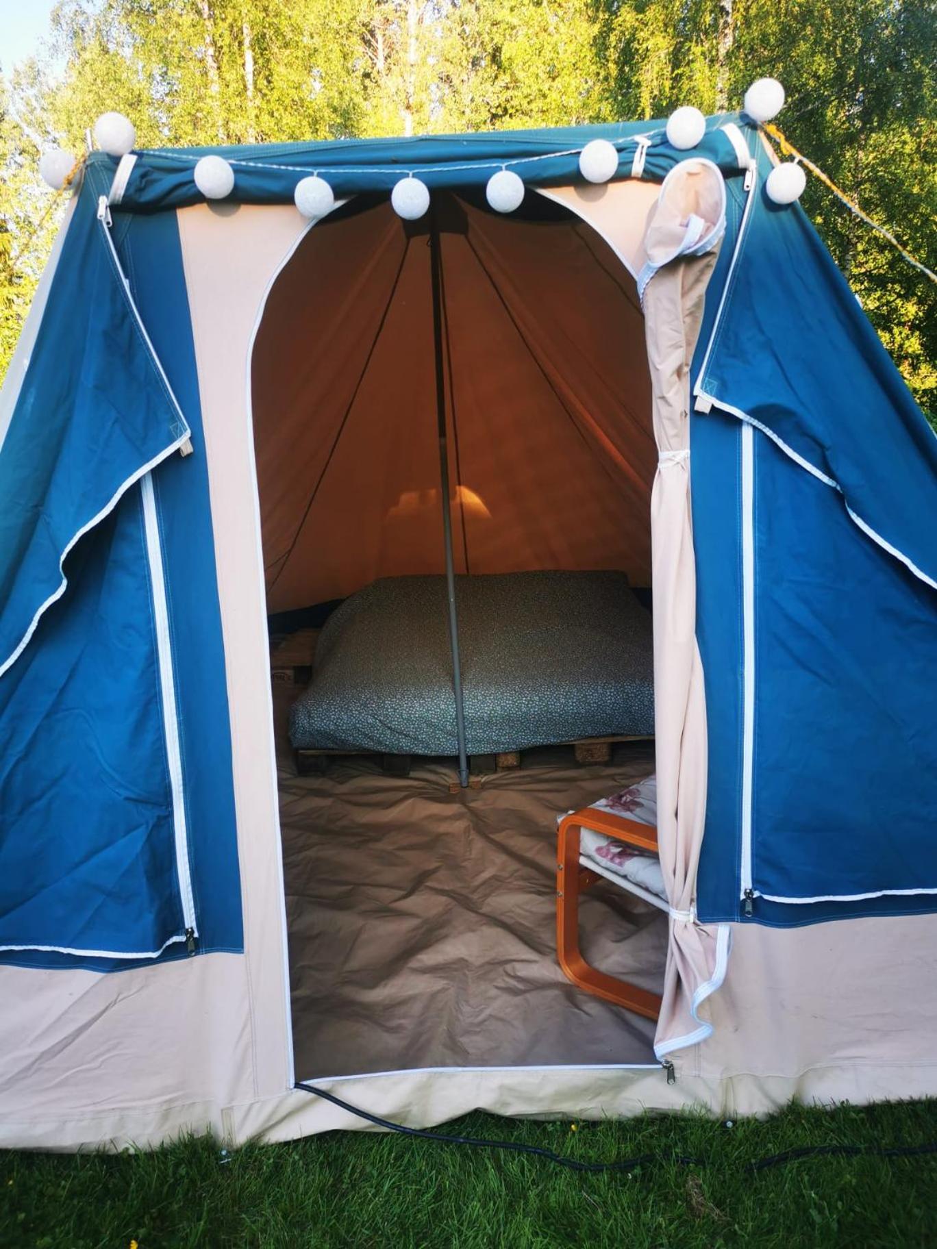 Cosy tent in garden of Swedish landhouse view 2