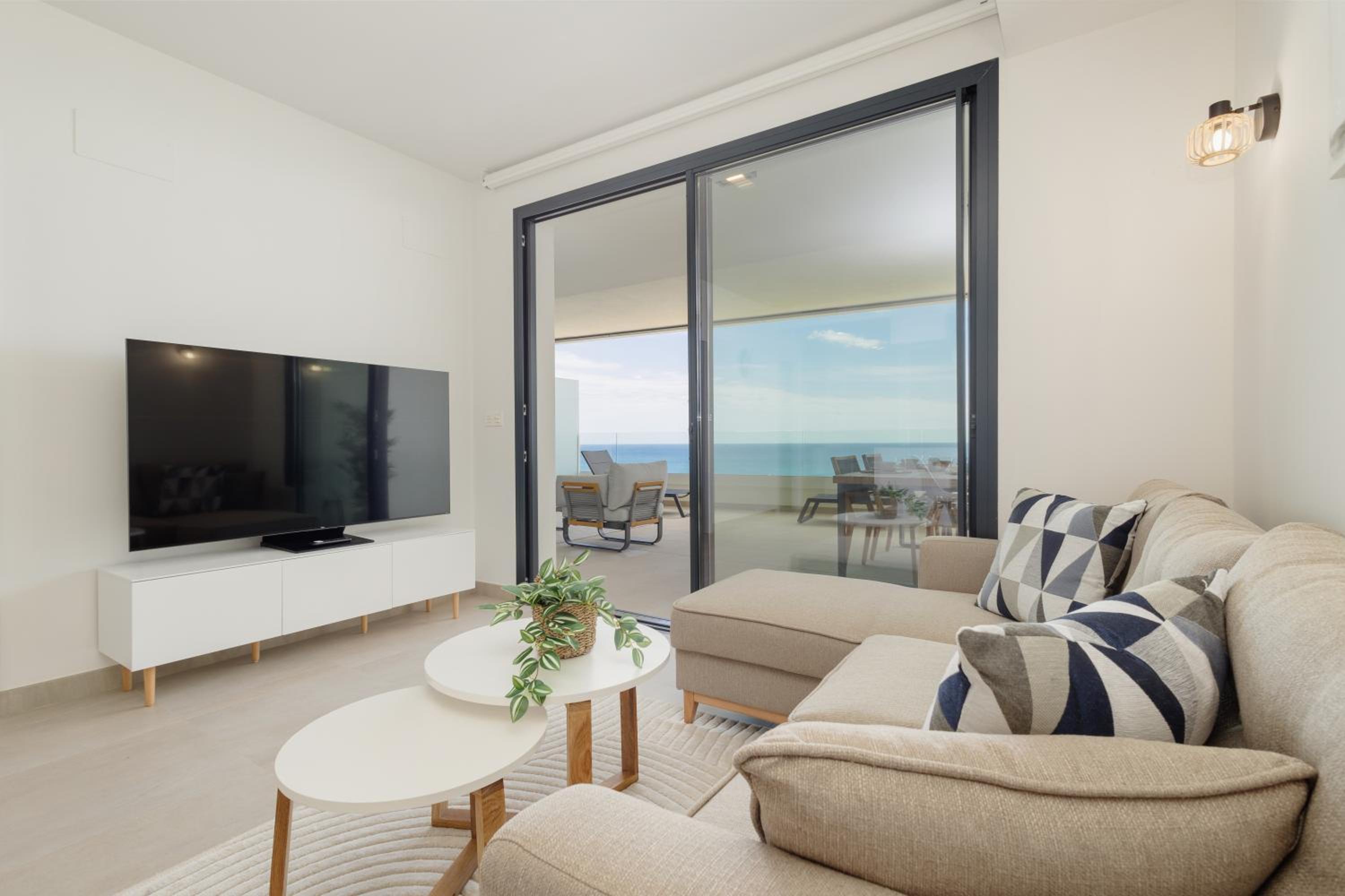 Modern apartment with a large private terrace, pool, sauna, gym, and sea views in Fuengirola