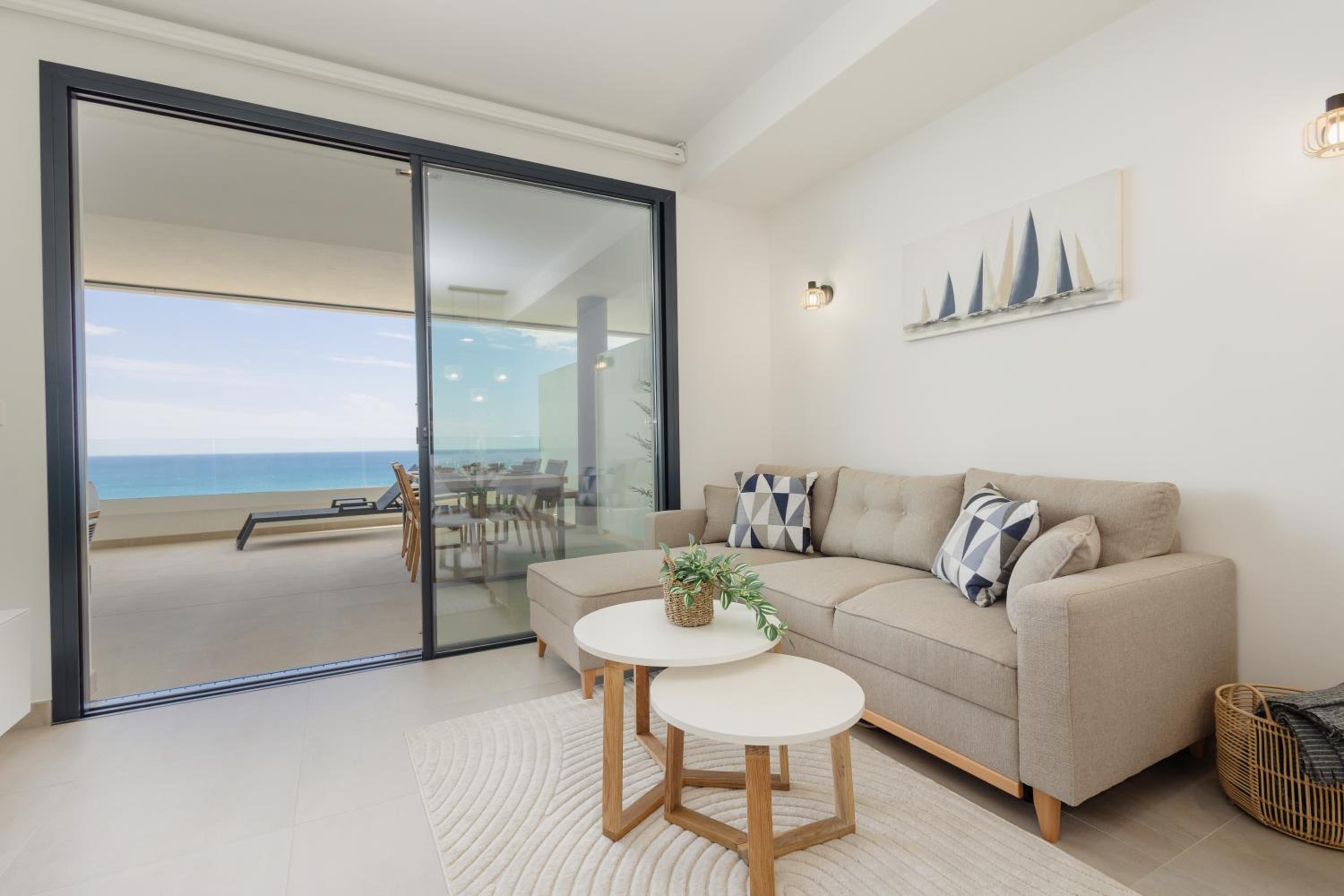 Modern apartment with a large private terrace, pool, sauna, gym, and sea views in Fuengirola