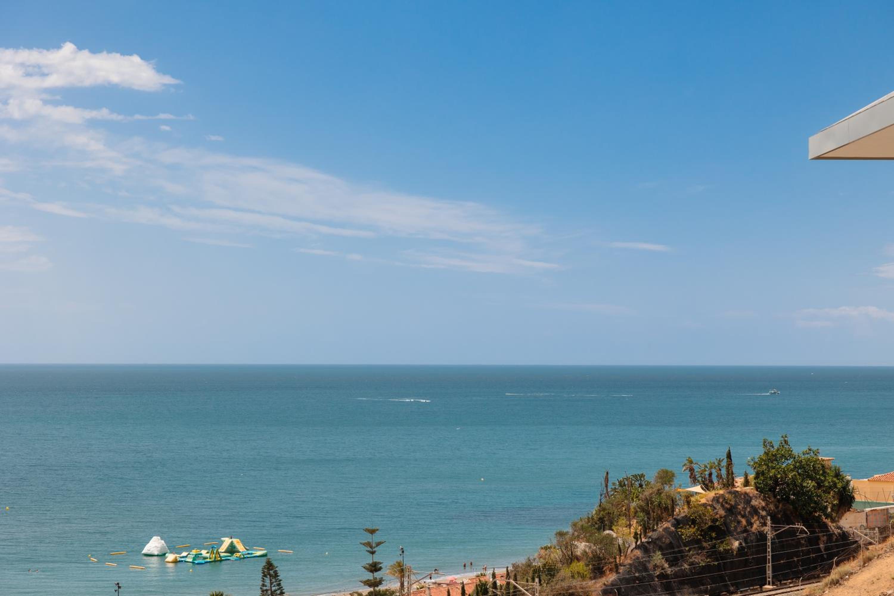 Modern apartment with a large private terrace, pool, sauna, gym, and sea views in Fuengirola