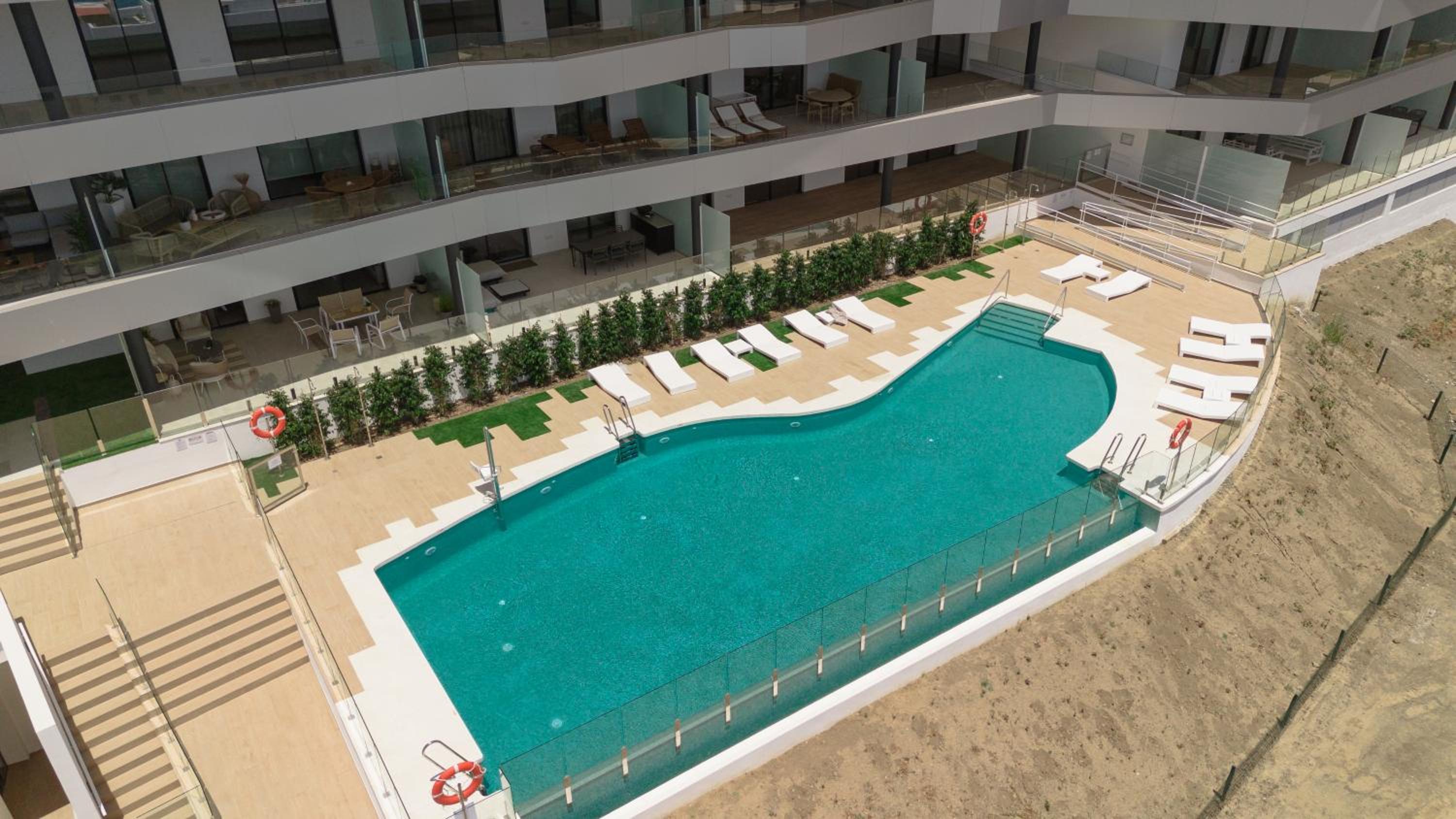 Modern apartment with a large private terrace, pool, sauna, gym, and sea views in Fuengirola