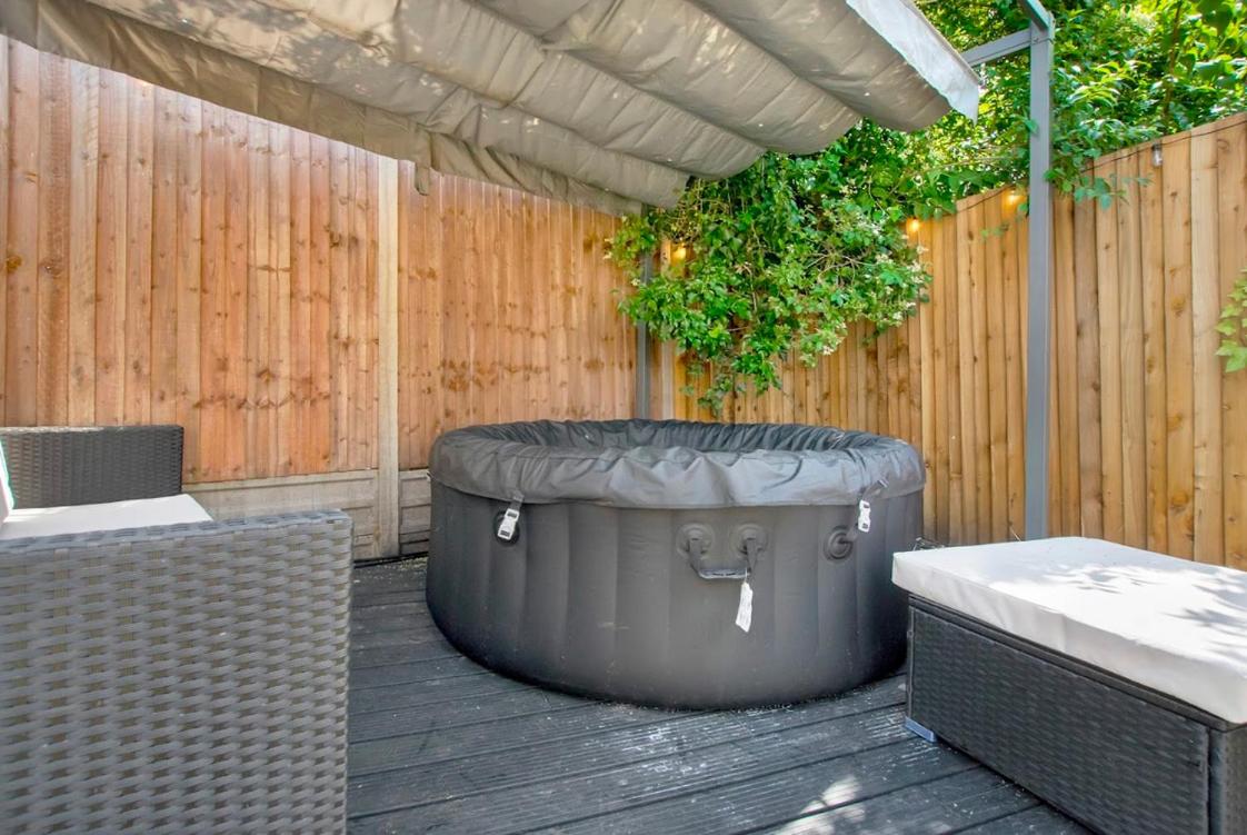 Charming Garden Retreat 3BDR with Hot Tub and Sauna view 2