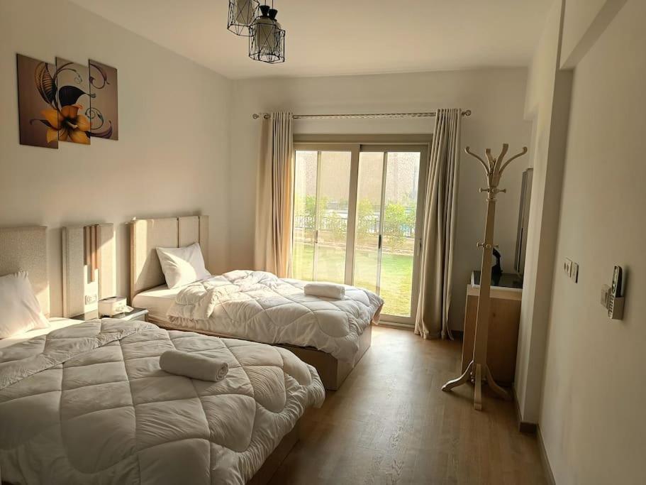 Carrara White 3BR APT W/Garden view and Pool