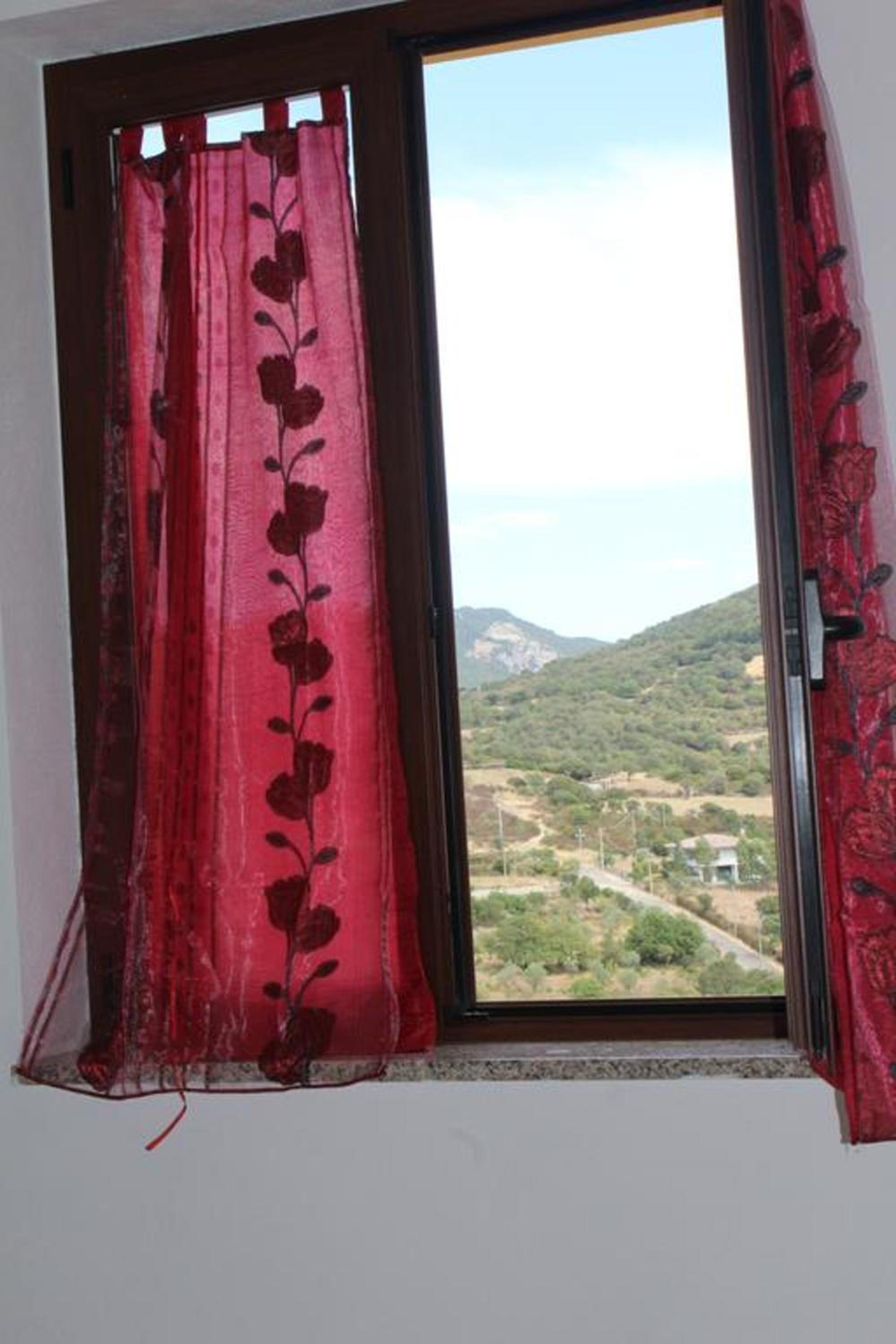Charming apartment in Nughedu Santa Vittoria - 90 m² with fireplace view 4