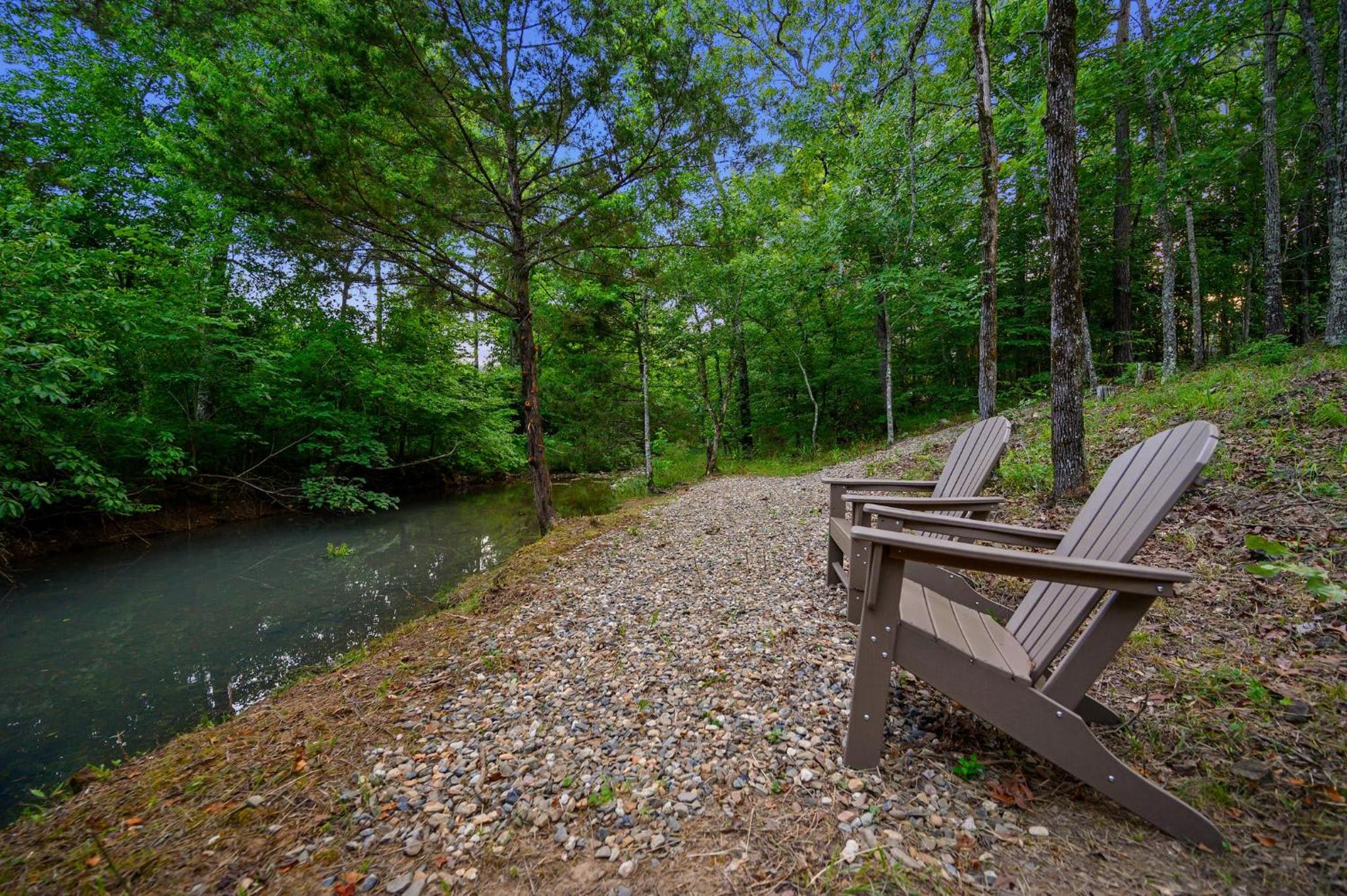 Pet friendly family cabin with firepit creek outdoor kitchen playset & more view 5