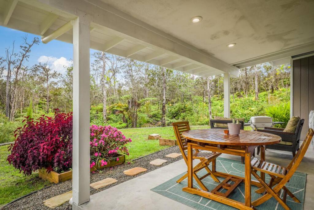 Serene Modern Escape with fireplace and outdoor shower view 4