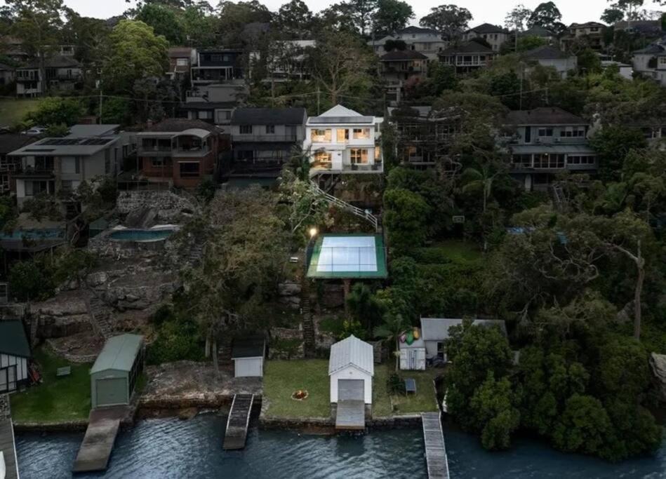 Luxurious Waterfront Retreat with Tennis Court