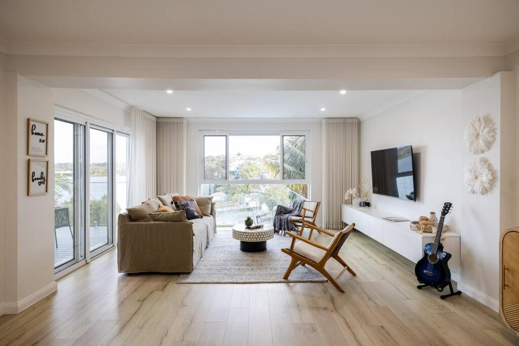 Luxurious Waterfront Retreat with Tennis Court